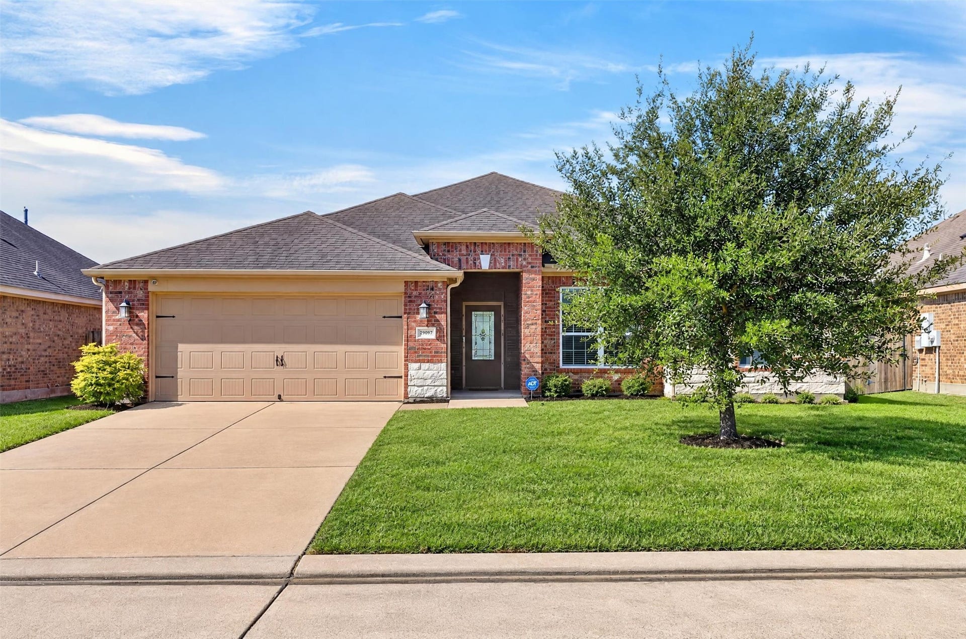 22907 Gentle Shadow Drive, Hockley, TX 77447 The home's brick exterior and established landscaping add character, while the single-story design keeps everyday living on one level.