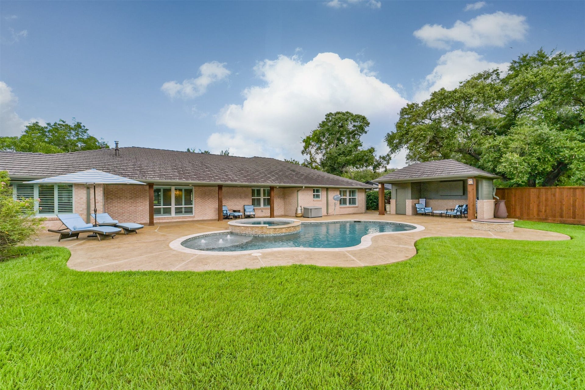 3210 Nottingham Street, Pearland, TX 77581 View of pool and back of home.