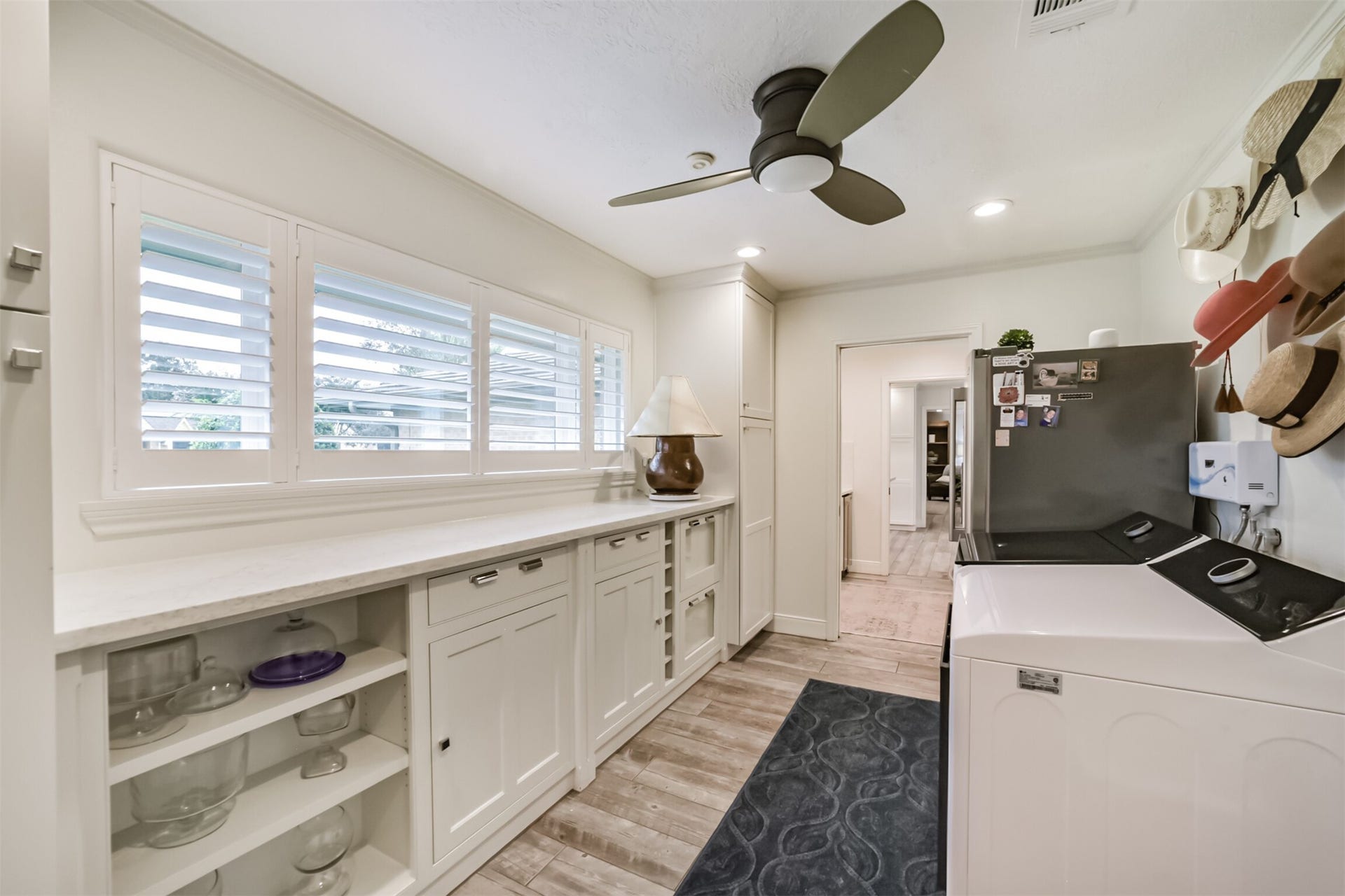 3210 Nottingham Street, Pearland, TX 77581 Laundry Room is large with built in shelving, folding counter and plenty of room for an extra refrigerator!