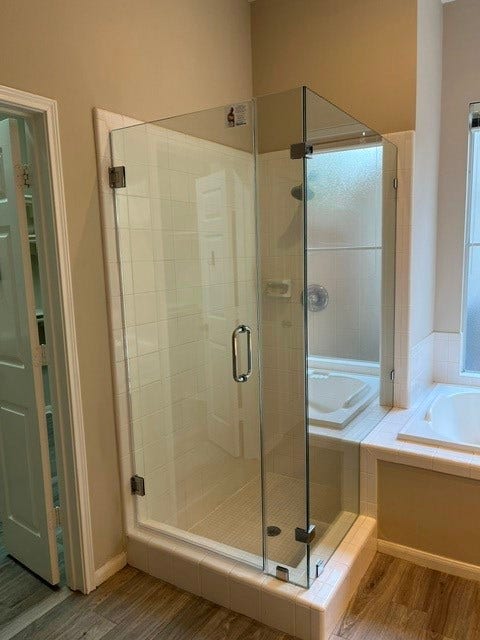 14 Tethered Vine Place, The Woodlands, TX 77382 NEW frameless shower door in Master bath. Seperate tub