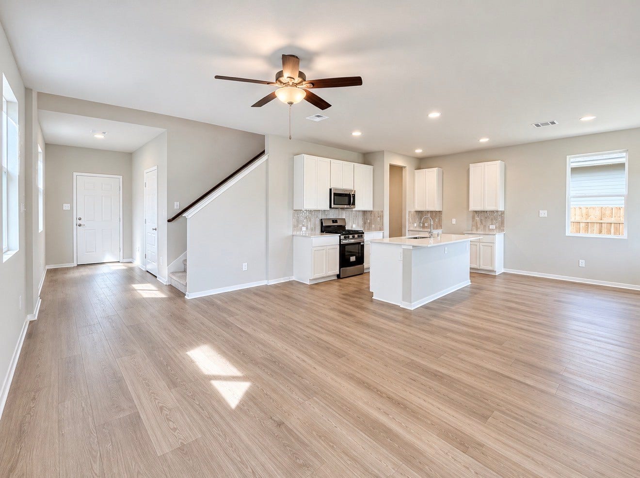 Living room into kitchen representative photo