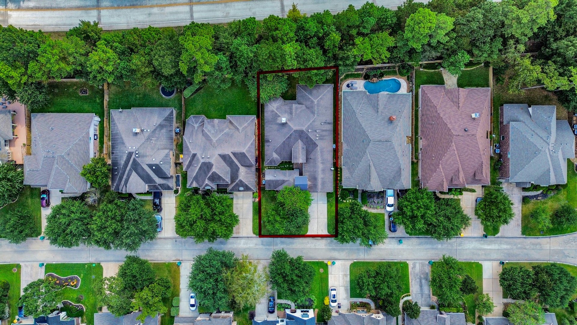 143 Pronghorn Place, Montgomery, TX 77316 Charming suburban home nestled in a tree-lined neighborhood, featuring a spacious backyard bordering lush greenery. The property offers a generous driveway and is part of a peaceful community with easy access to nearby amenities.