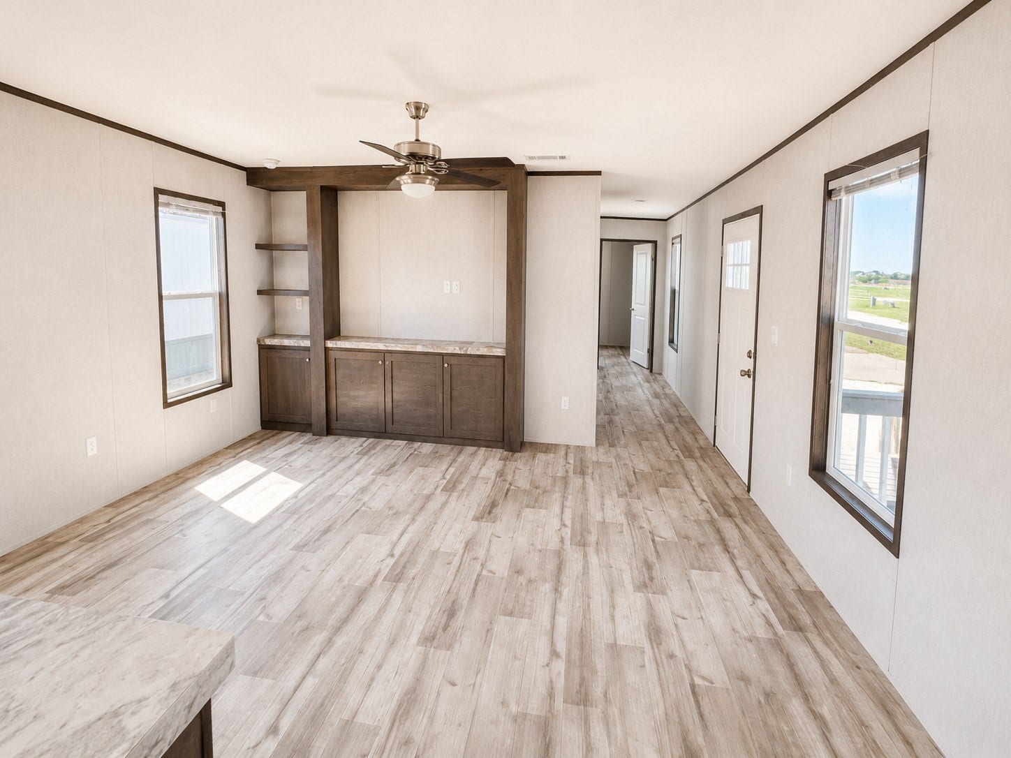 6220 Katy Hockley Road, #46, Katy, TX 77493 Step into this bright and spacious living room, designed for comfort and everyday living! Featuring gorgeous wood-look flooring, beautiful natural light, a stylish ceiling fan, and a built-in entertainment center with shelving and storage, this inviting space is perfect for relaxing or entertaining guests. The open layout creates a warm and welcoming atmosphere you'll love coming home to!