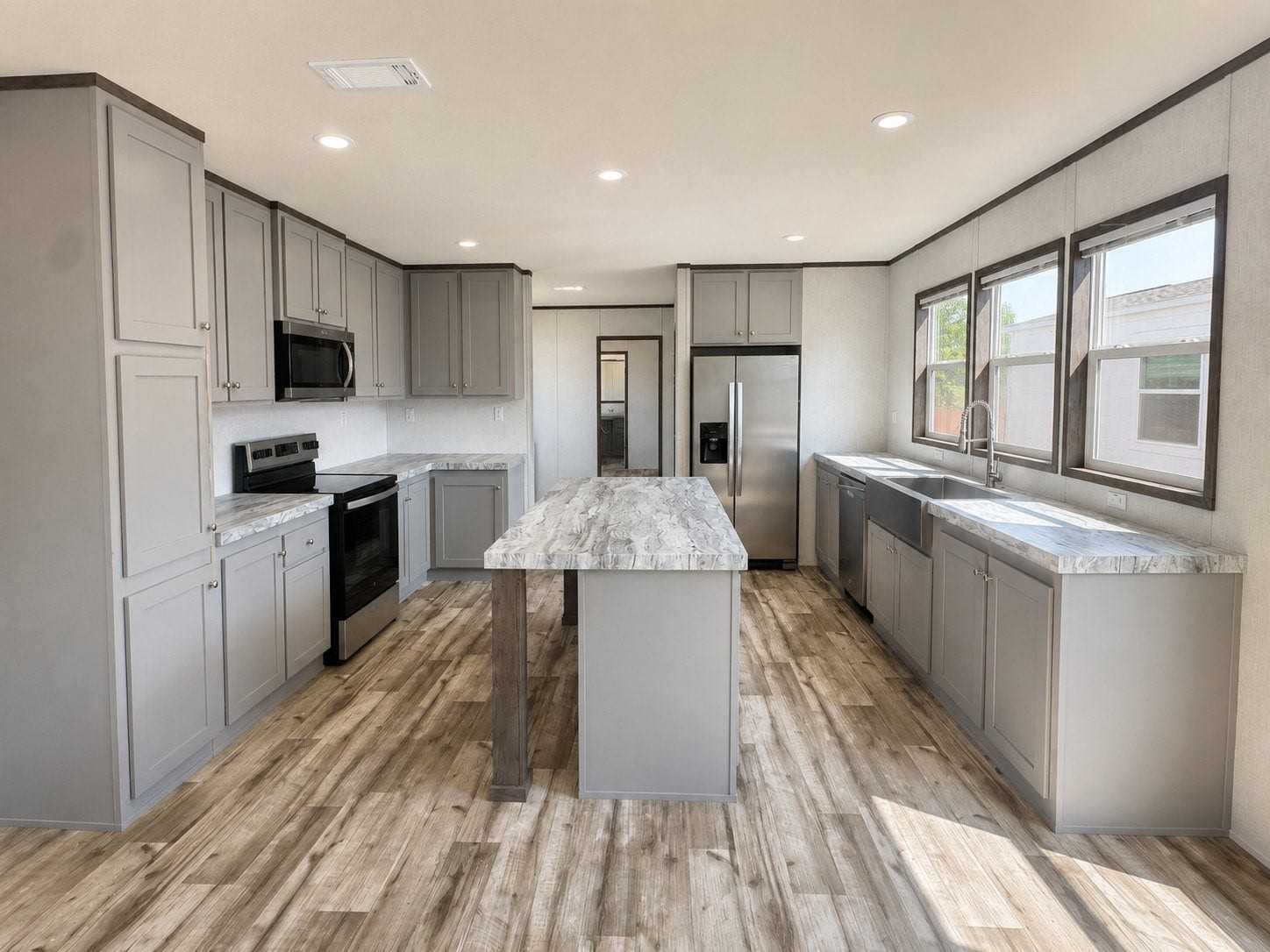 6220 Katy Hockley Road, #46, Katy, TX 77493 Fall in love with this stunning, modern kitchen featuring beautiful gray cabinetry, elegant marble-look countertops, and a spacious center island perfect for meal prep and entertaining! Enjoy stainless steel appliances, a stylish farmhouse sink, abundant cabinet space, and gorgeous wood-look flooring. Large windows fill the space with natural light, creating a bright and inviting atmosphere!