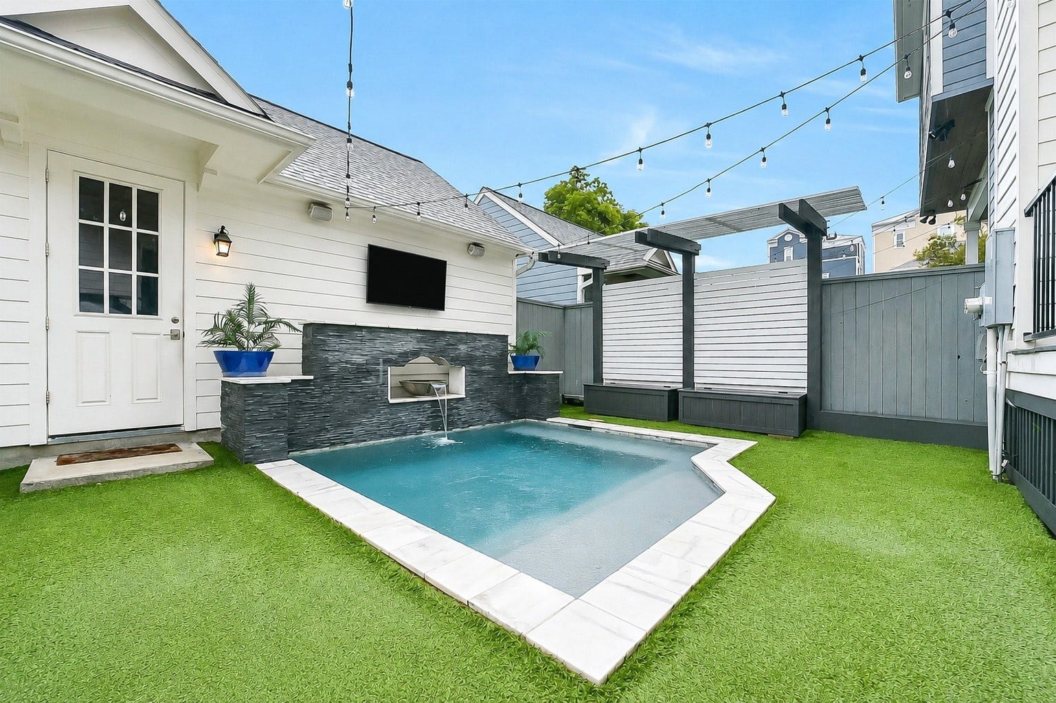 Sneak peek of this fabulous backyard complete with a pool, turfed yard and covered back porch! Perfect place to enjoy the hot Houston summers! Landlord maintains the yard and pool!