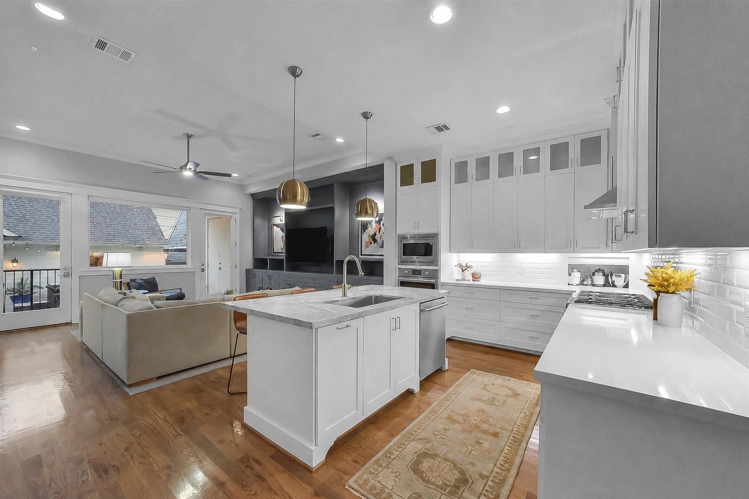Open floor plan with the  kitchen and the adjoining family room; designed for both entertaining and everyday living.
