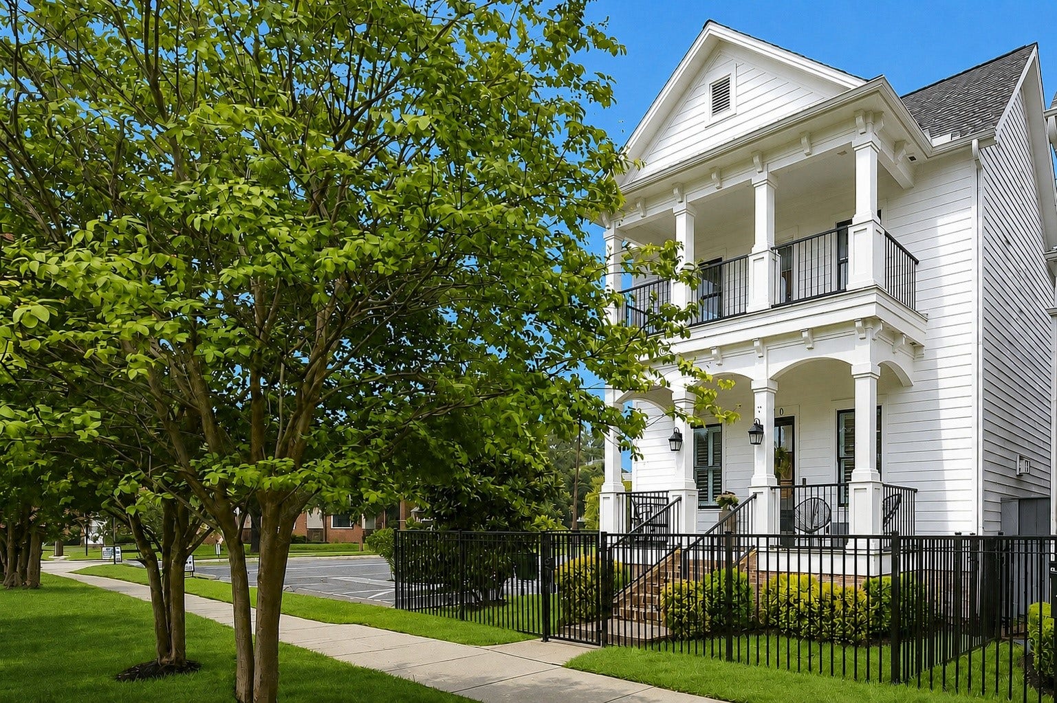Another view of the charming front elevation showcasing the covered porch, manicured landscaping, and welcoming architectural details. Ideally situated just blocks from Historic 19th Street and close to popular destinations including Jenni's Ice Cream, Common Bond, Boomtown Coffee, Hopdoddy, Squable, Agnes Sherman, and Goode Co. Cantina.