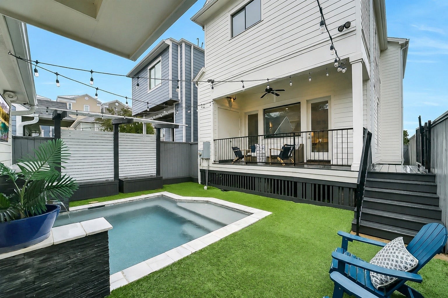Resort-inspired backyard centered around a saltwater pool with water feature, completed in 2018. Designed for both relaxation and entertaining while offering a private outdoor retreat in the heart of the Heights. Cabana with built-in bench seating and storage. Turfed green space, and privacy fencing. Thoughtfully designed for low-maintenance outdoor enjoyment all year long.