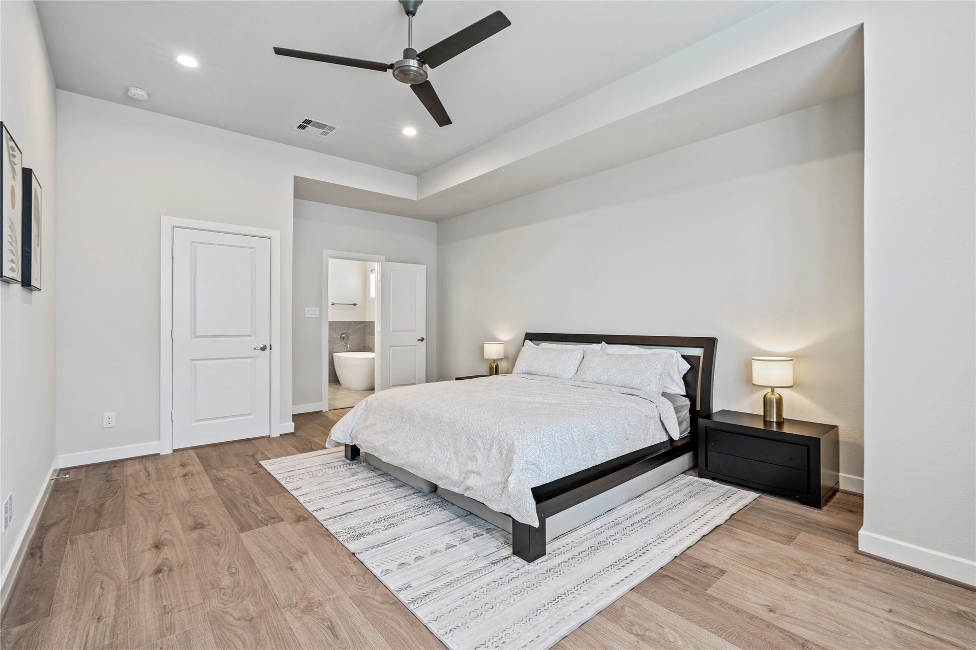 3916 Willowbend Point Drive, Houston, TX 77025 Representative photo showing the communitys model home primary bedroom. Layout and selections may vary.