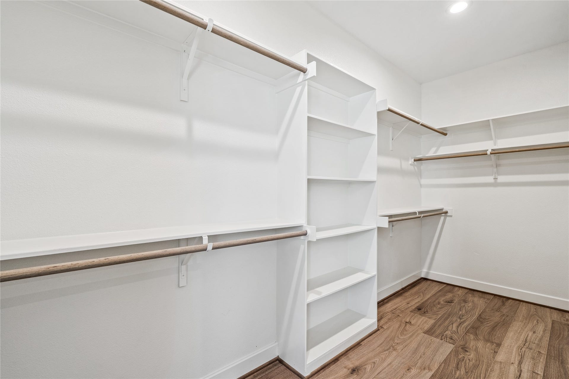 3916 Willowbend Point Drive, Houston, TX 77025 Representative photo showing the communitys model home primary walk-in closet. Layout and selections may vary.