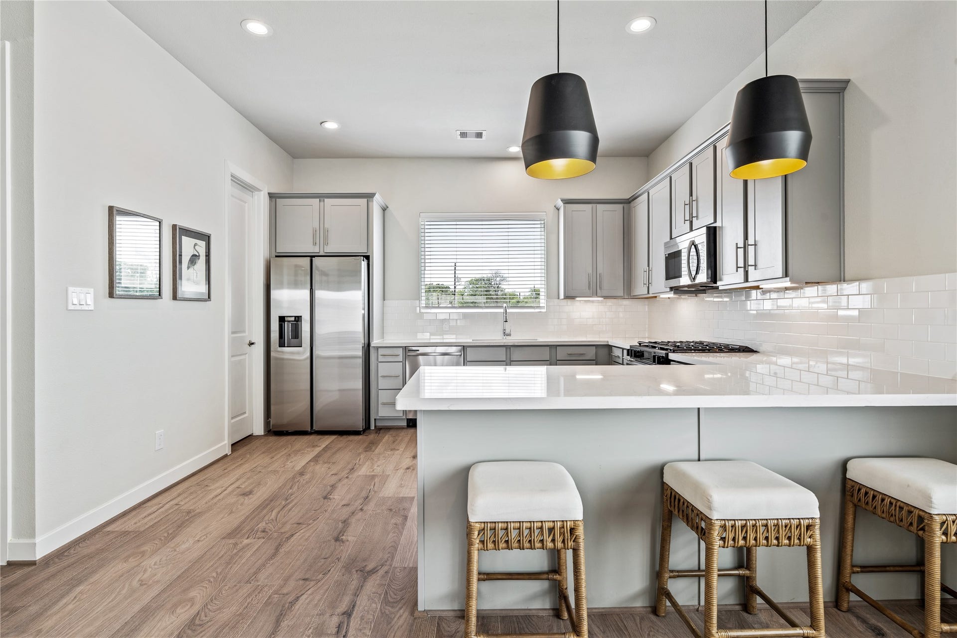 3916 Willowbend Point Drive, Houston, TX 77025 Representative photo showing the communitys model home kitchen. Layout and selections may vary.