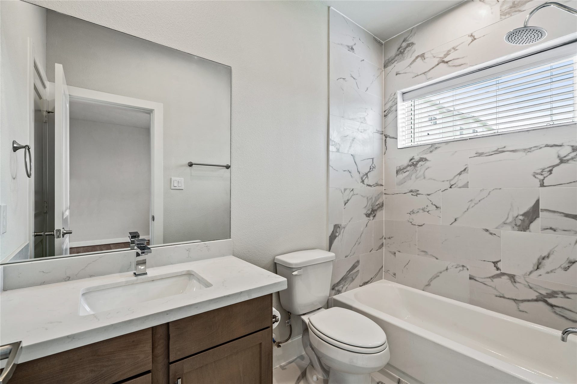 3916 Willowbend Point Drive, Houston, TX 77025 Representative photo showing the communitys model home secondary bathroom. Layout and selections may vary.