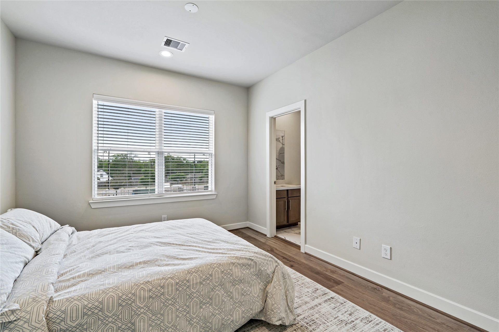 3916 Willowbend Point Drive, Houston, TX 77025 Representative photo showing the communitys model home secondary bedroom. Layout and selections may vary.