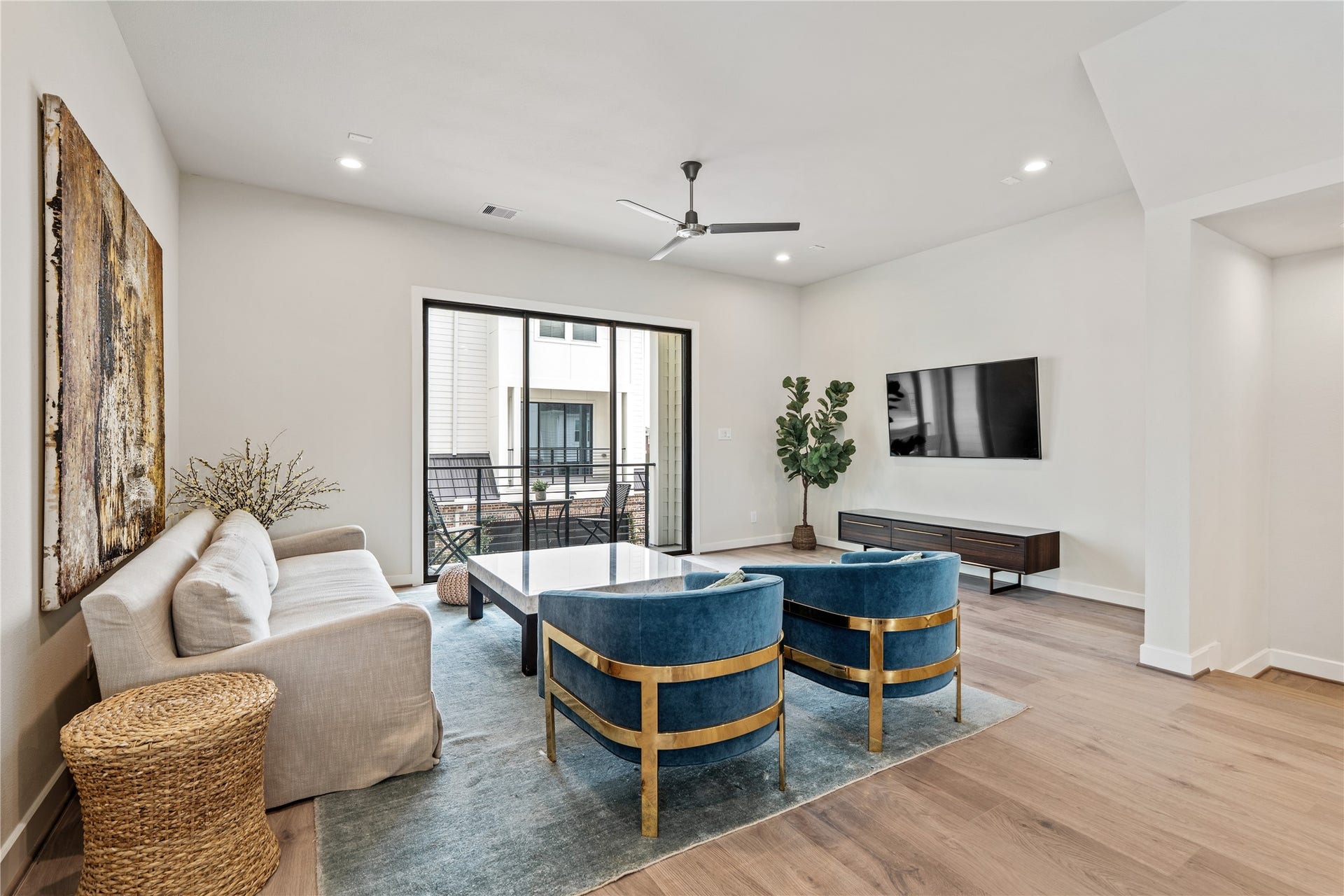 3916 Willowbend Point Drive, Houston, TX 77025 Representative photo showing the communitys model home living room. Layout and selections may vary.
