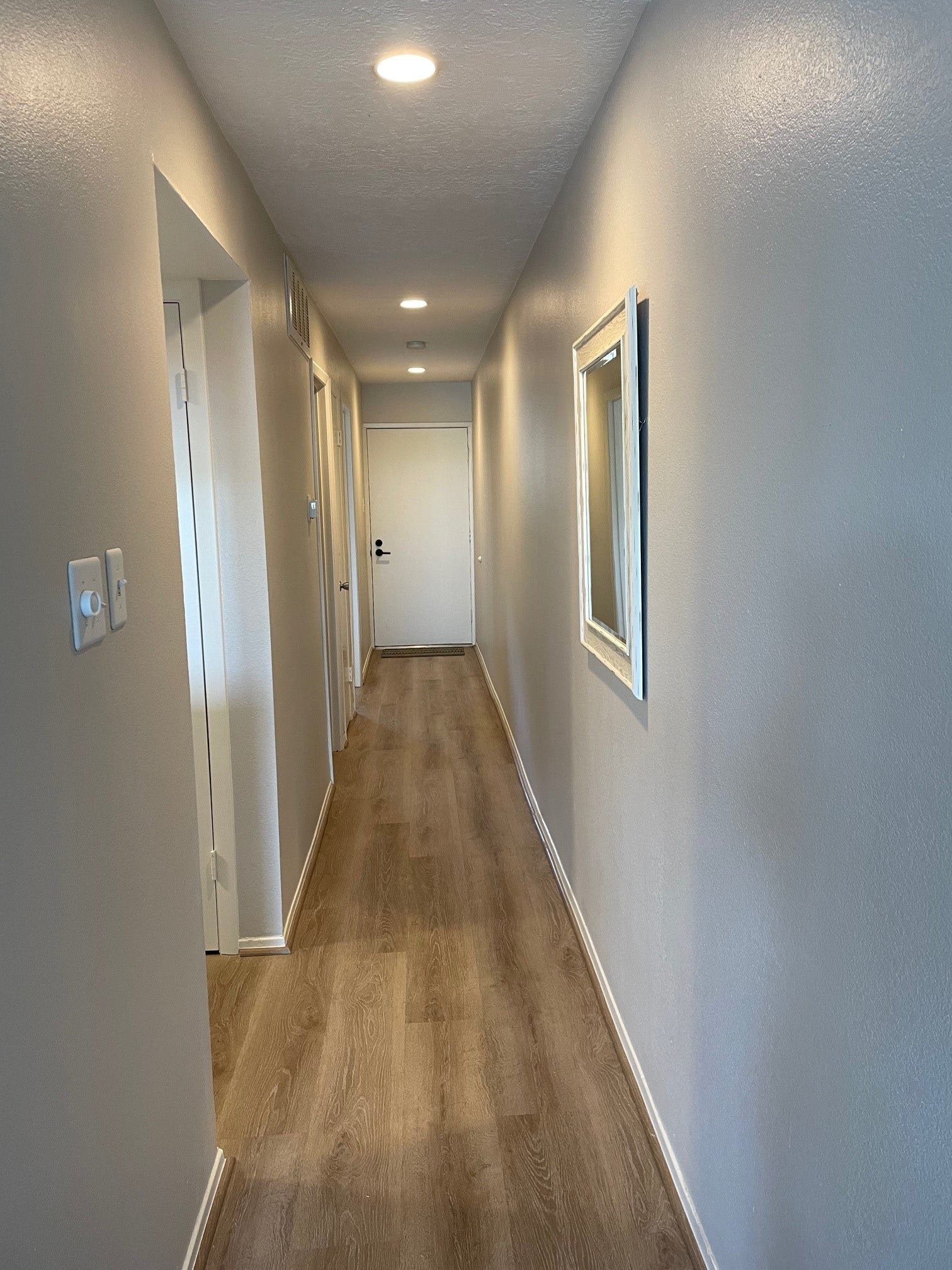 12600 Melville Drive, #203A, Montgomery, TX 77356 Beautiful recessed lighting in hallway and living area. Extra storage in the hall closet.