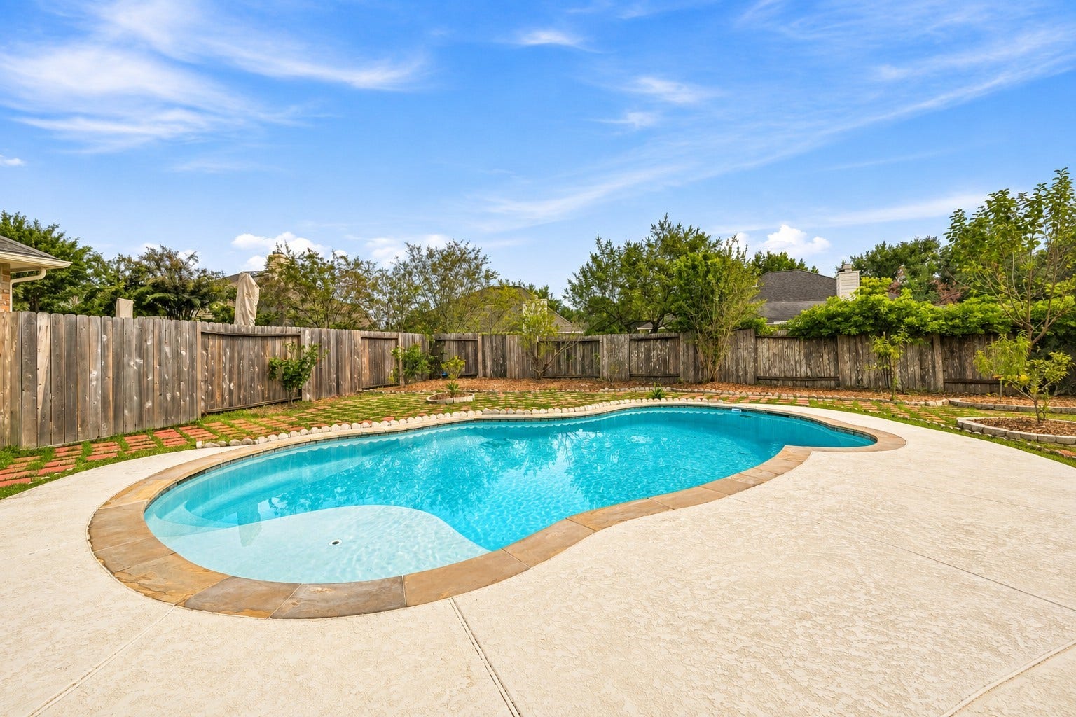 2611 Oxhill Court, Pearland, TX 77584 Sparkling in-ground pool, creating the perfect centerpiece for outdoor relaxation and entertaining.
