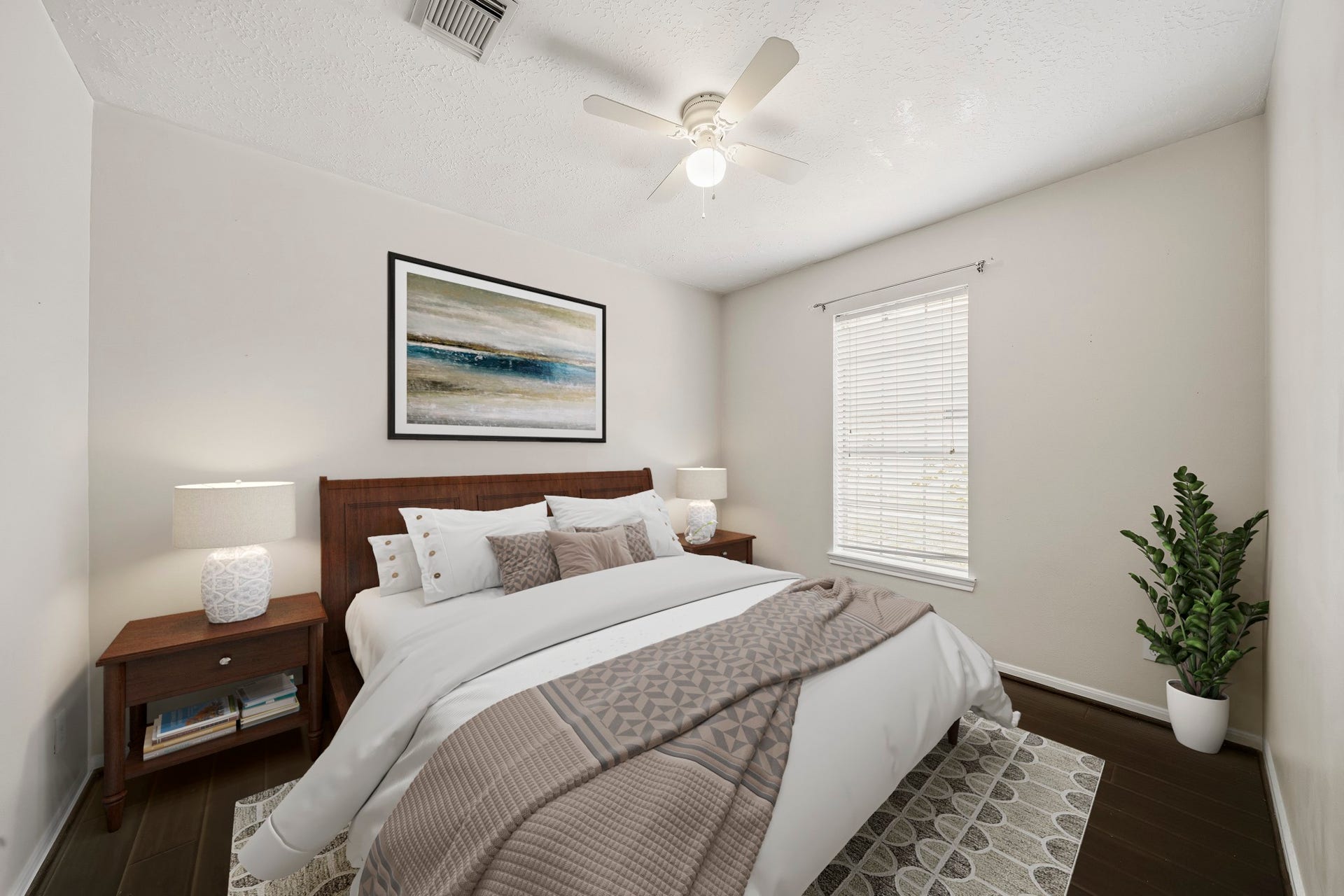 2611 Oxhill Court, Pearland, TX 77584 Virtually Staged: This inviting secondary bedroom features rich wood flooring, neutral walls, and a large window that brings in abundant natural light, while a ceiling fan adds everyday comfort. Clean finishes and warm tones create a cozy, welcoming space ideal for family or guests.