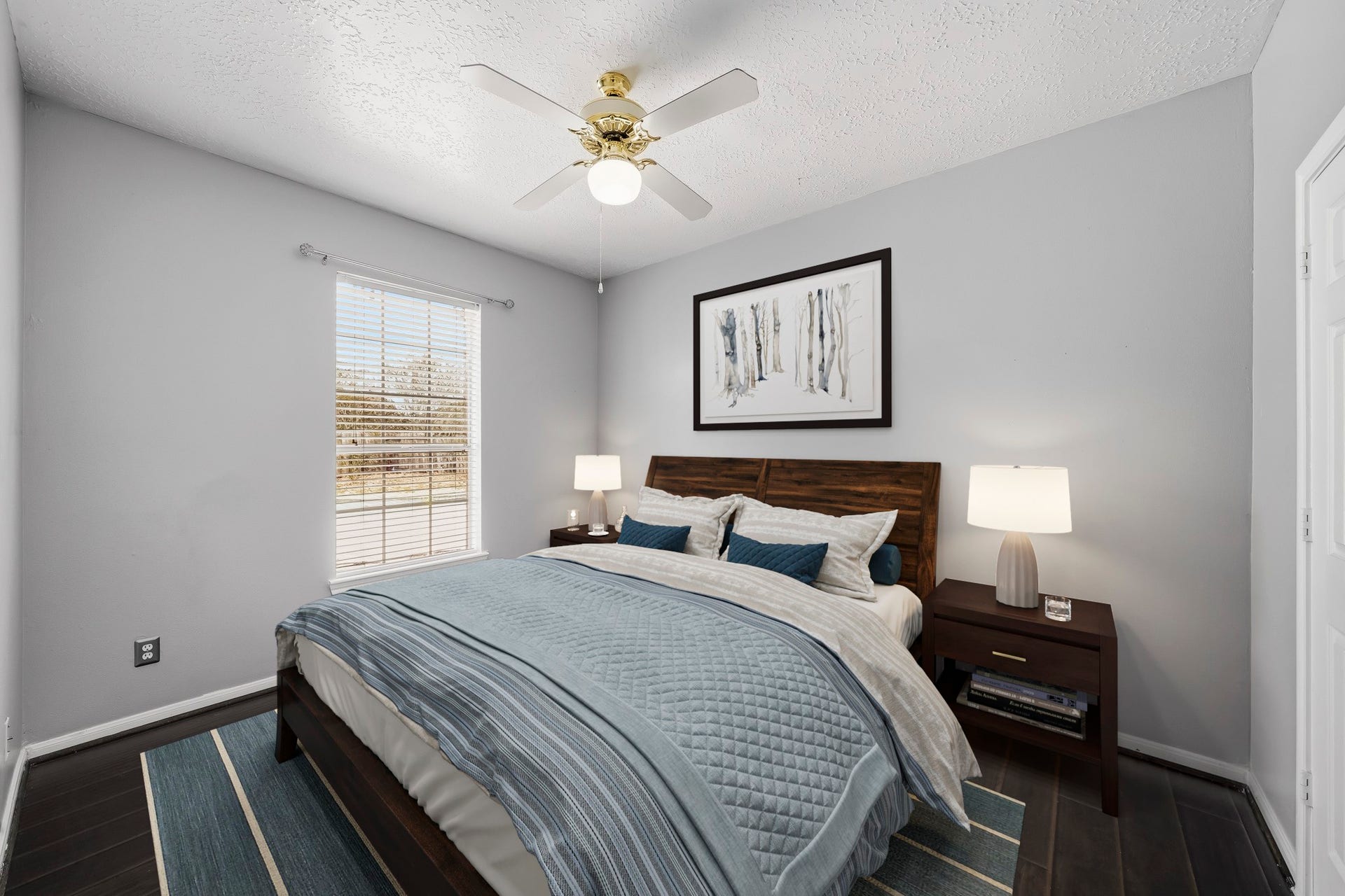2611 Oxhill Court, Pearland, TX 77584 Virtually Staged: This comfortable secondary bedroom features rich wood flooring, neutral walls, and a high ceiling that enhances the sense of space. A large window provides plenty of natural light.