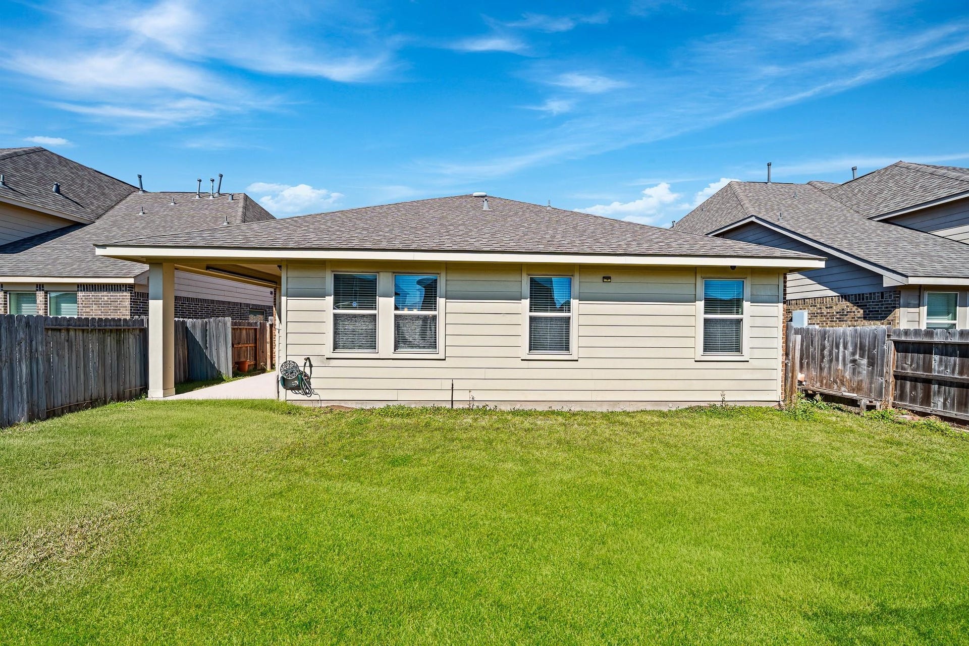 20427 Alpine Meadow Place, Richmond, TX 77407 A spacious backyard and covered outdoor living area create a great setting for everyday enjoyment.
