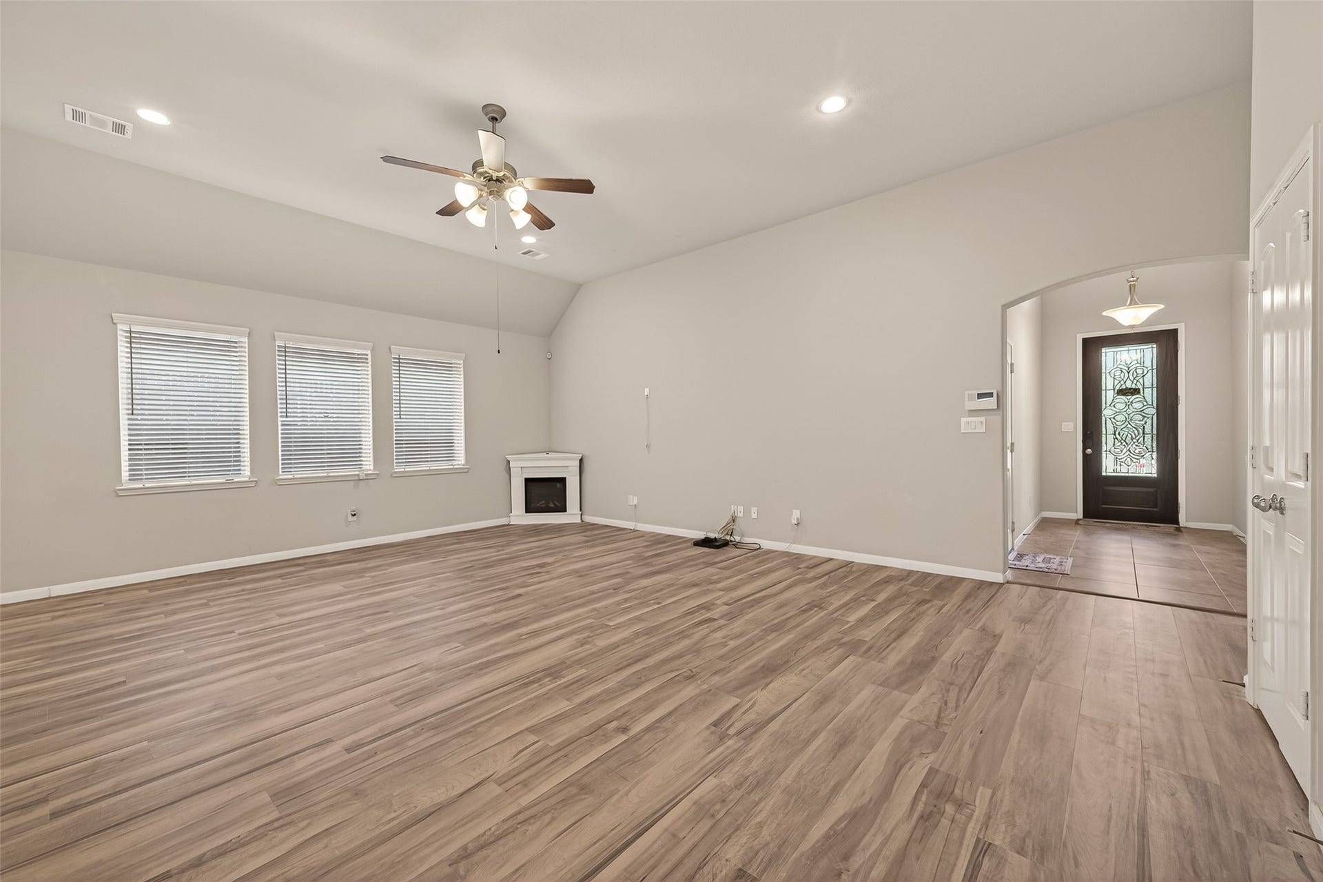 20427 Alpine Meadow Place, Richmond, TX 77407 Open sightlines connect the main living spaces, creating an inviting atmosphere for everyday living.