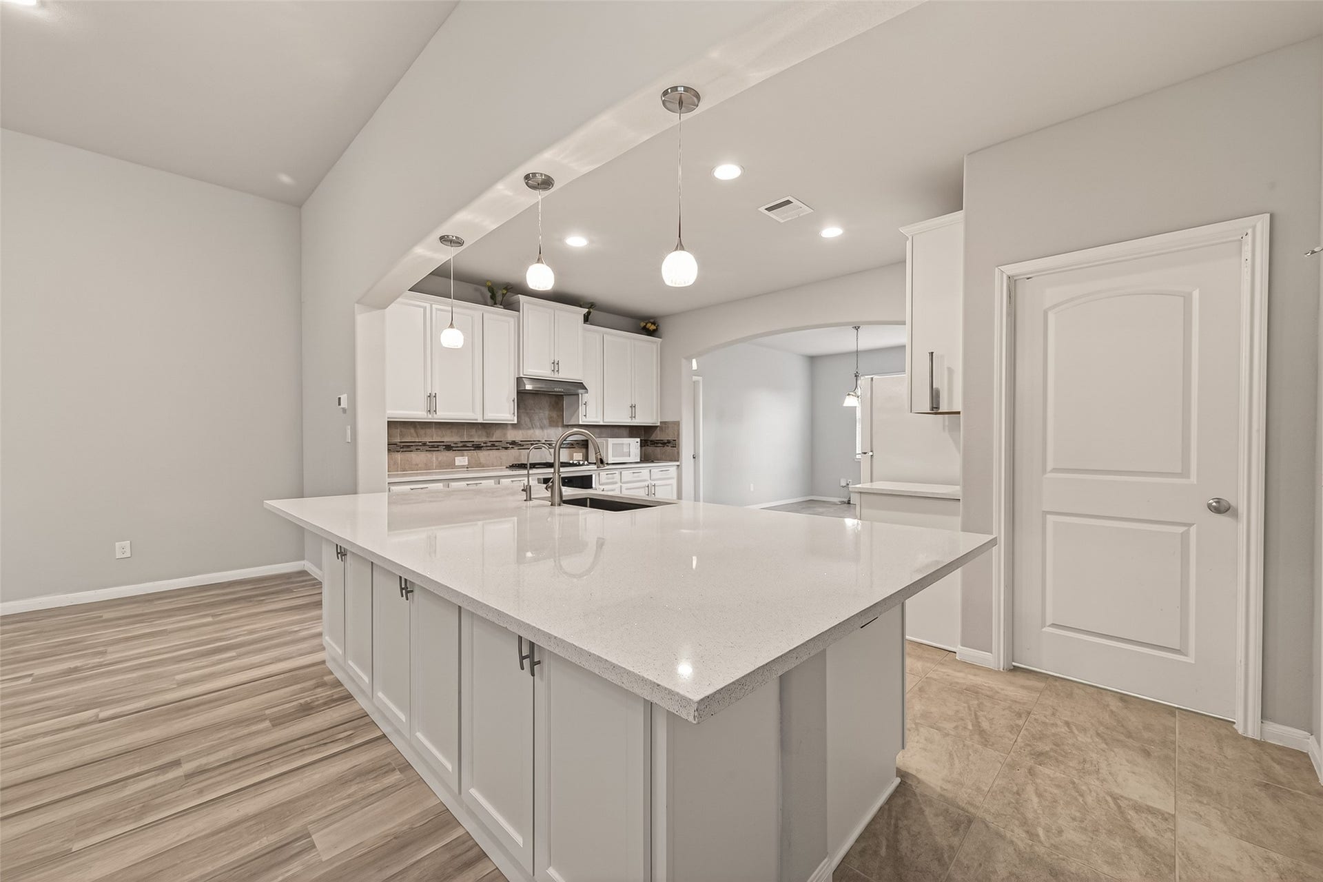 20427 Alpine Meadow Place, Richmond, TX 77407 The kitchen features a large island, generous storage, and plenty of room for meal preparation.