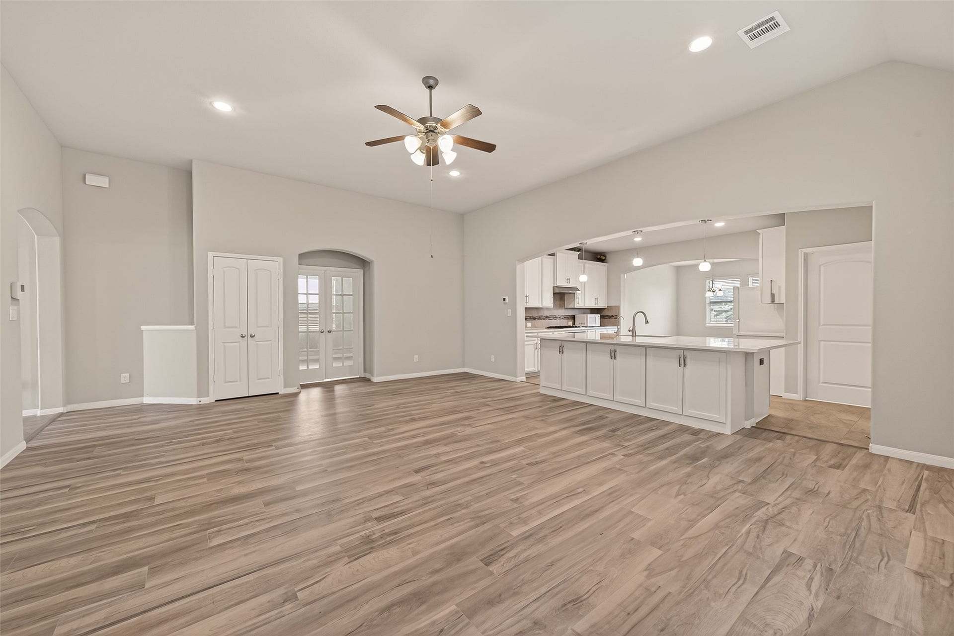 20427 Alpine Meadow Place, Richmond, TX 77407 The living area flows naturally into the kitchen and dining spaces, making entertaining easy.