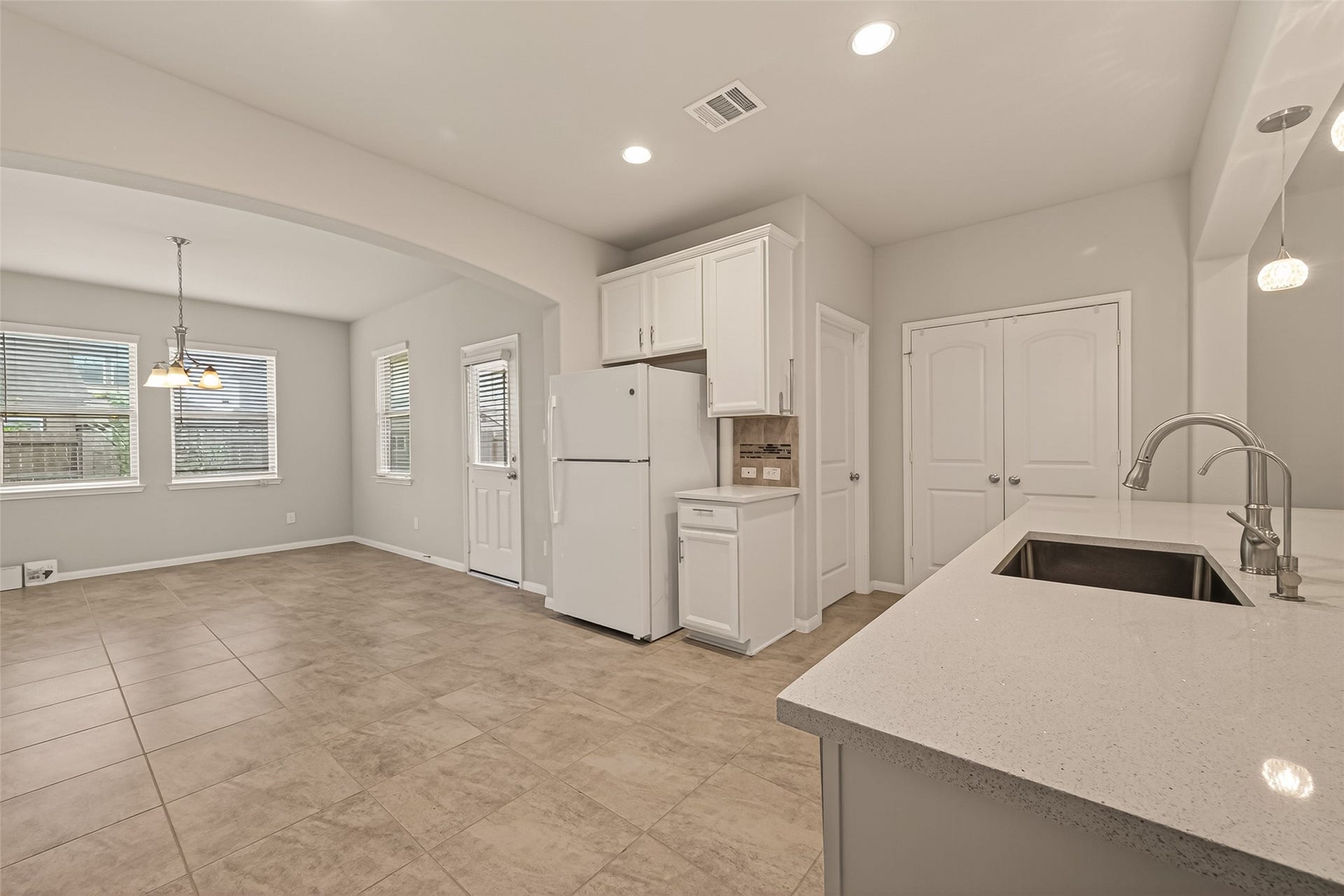 20427 Alpine Meadow Place, Richmond, TX 77407 Enjoy a functional kitchen layout with ample workspace and views of the surrounding living areas.