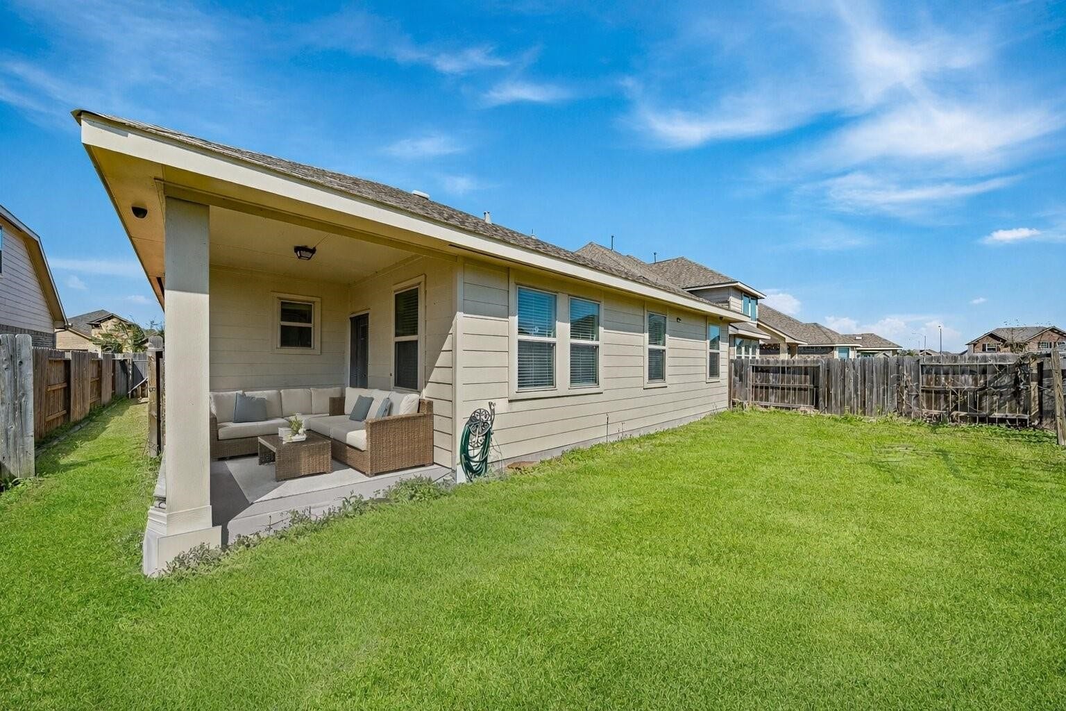 20427 Alpine Meadow Place, Richmond, TX 77407 Covered patio offers the perfect spot to relax, dine outdoors, or enjoy the fresh air.