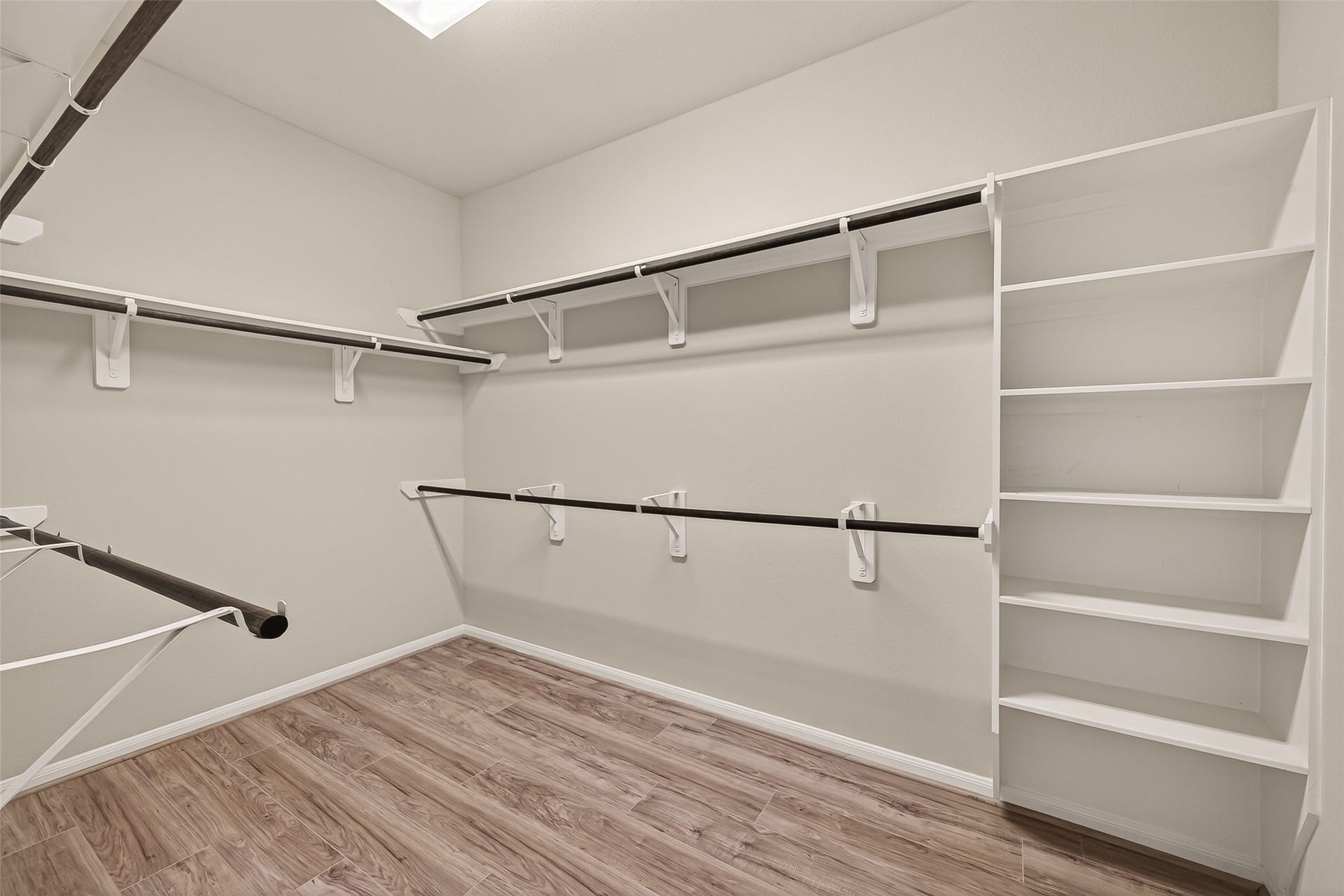 20427 Alpine Meadow Place, Richmond, TX 77407 Large walk in closet with built in shelving and plenty of space to stay organized.