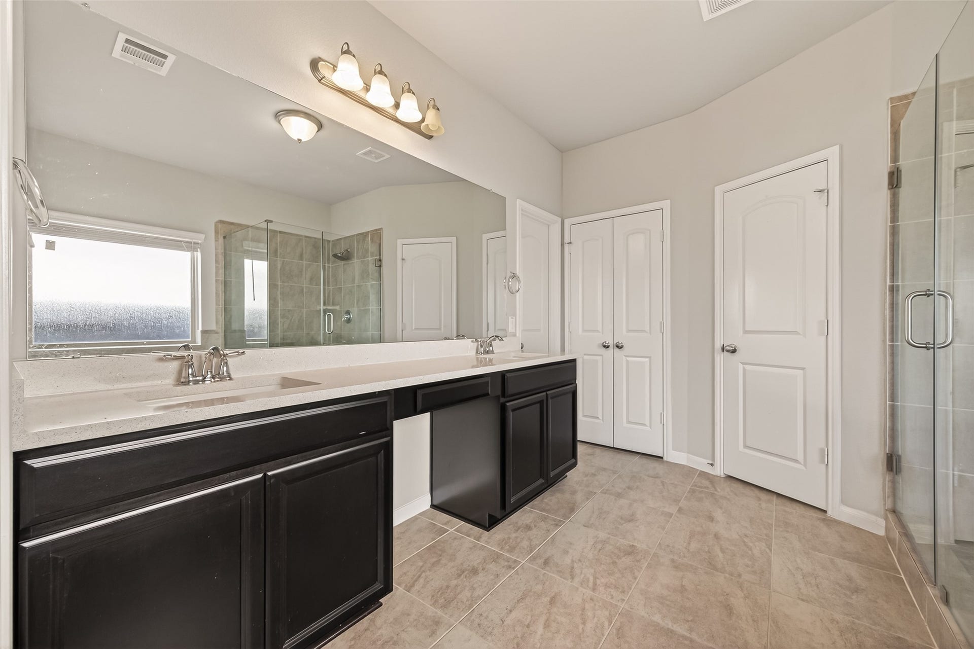 20427 Alpine Meadow Place, Richmond, TX 77407 Thoughtfully designed primary bath with abundant storage and plenty of room to get ready each day.