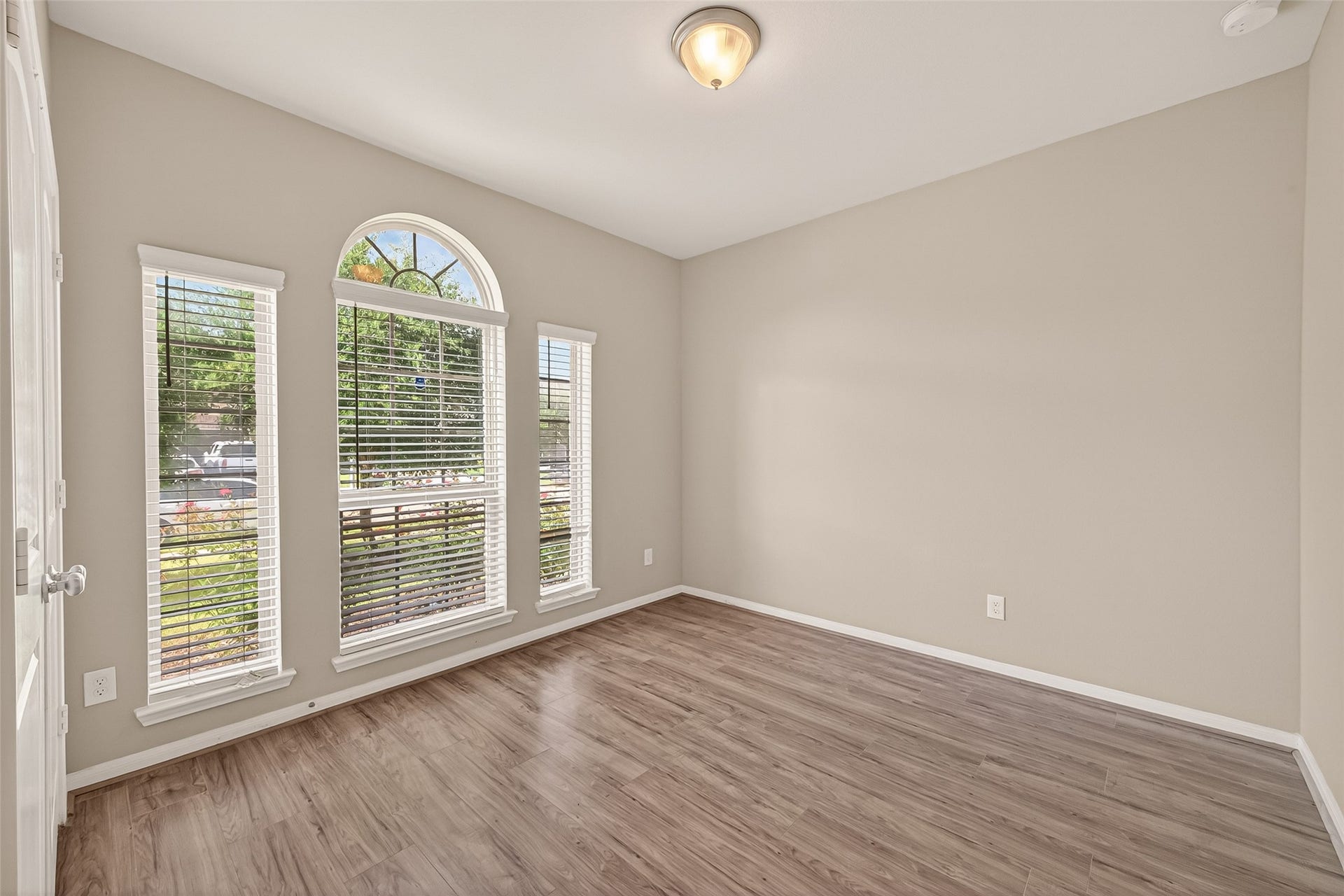 20427 Alpine Meadow Place, Richmond, TX 77407 The primary bedroom offers a peaceful retreat with large windows and plenty of natural light.