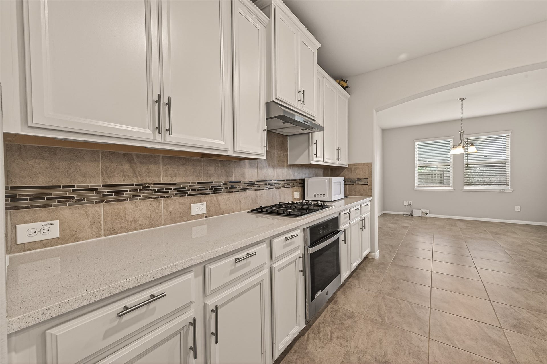 20427 Alpine Meadow Place, Richmond, TX 77407 Thoughtfully designed kitchen with abundant cabinetry and a bright, open feel.
