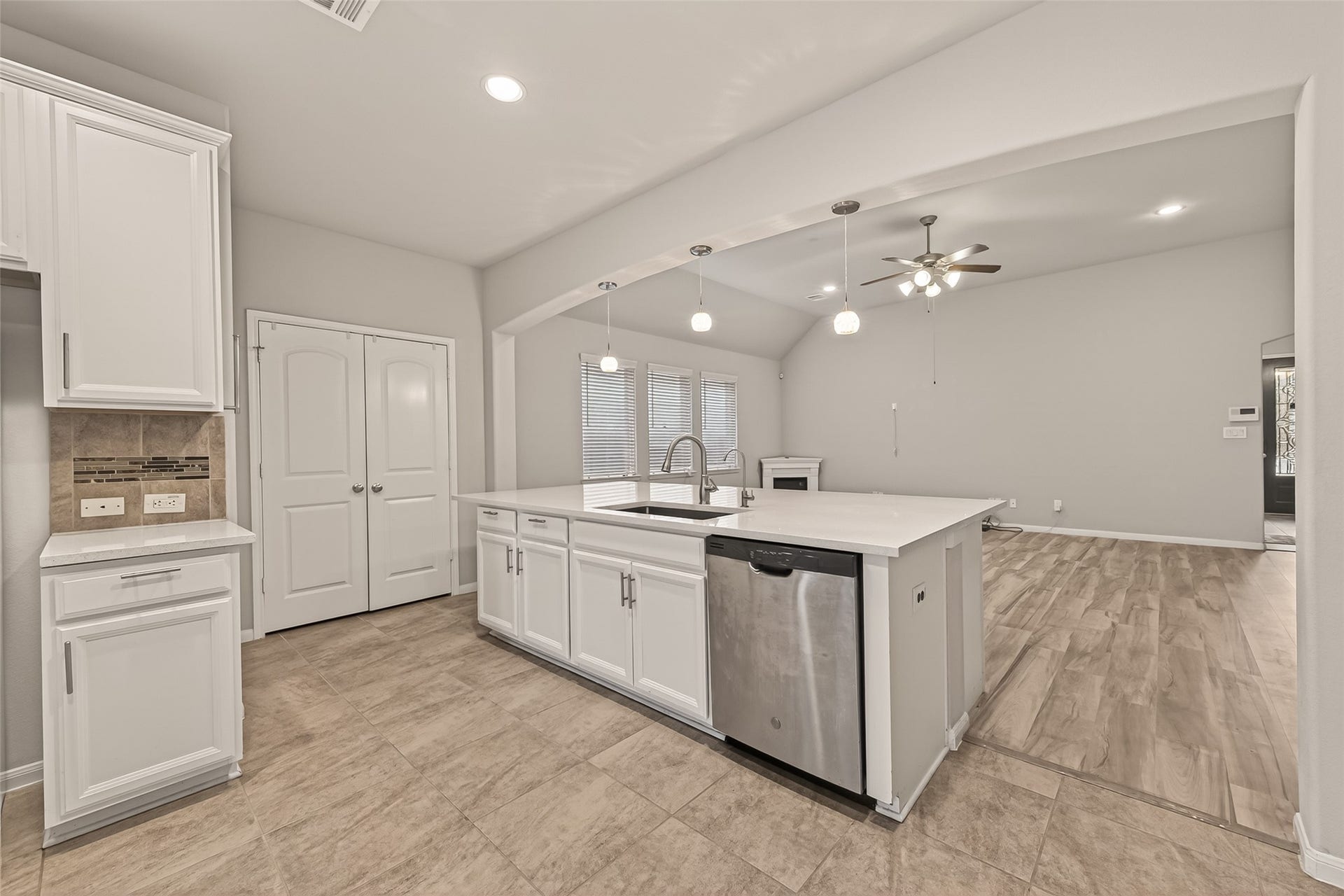 20427 Alpine Meadow Place, Richmond, TX 77407 The oversized island creates a natural gathering space while keeping the kitchen open and inviting.
