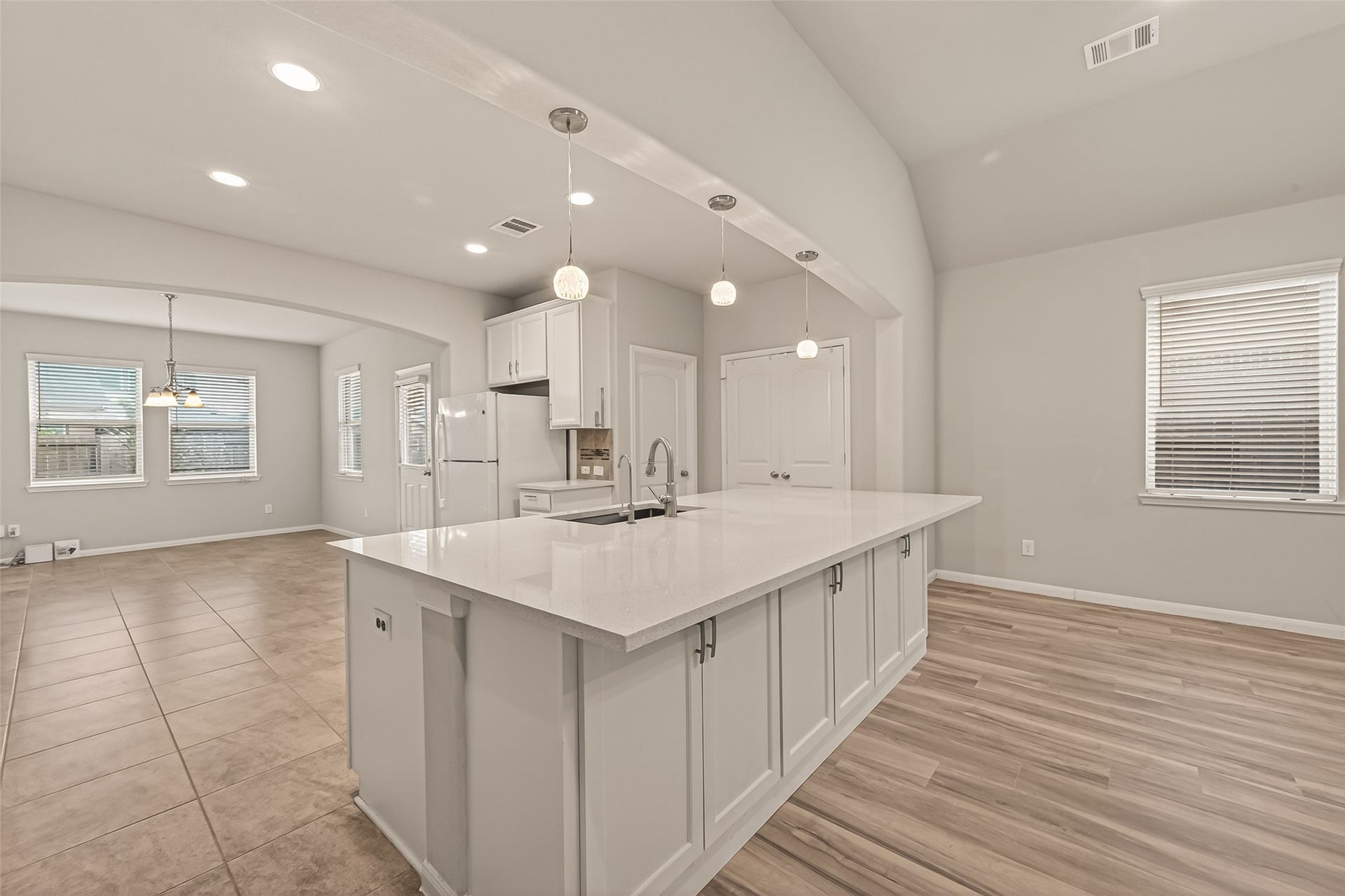 20427 Alpine Meadow Place, Richmond, TX 77407 Gather around the oversized island, the perfect centerpiece for daily living and conversation.