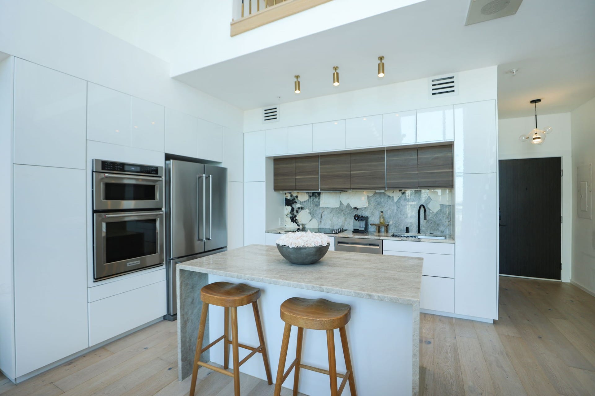 Waterfall island with bar seating, ideal for casual dining and entertaining.