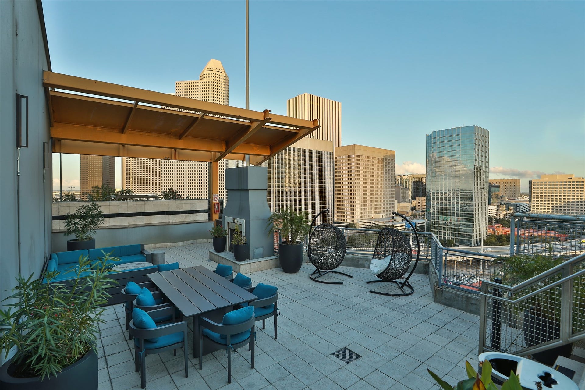 Roof top deck has an outdoor kitchen, fireplace, and lounging area to entertain your guests or relax and take in the views.