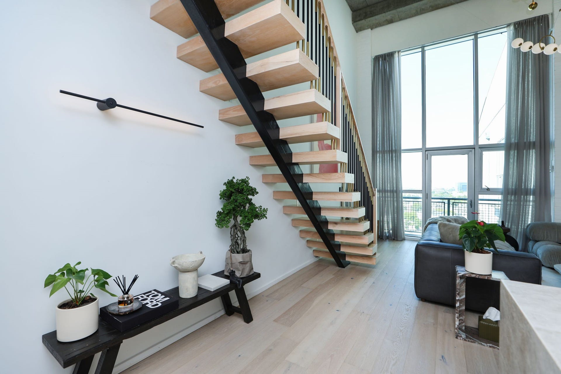 Live effortlessly with keyless entry, programmable thermostat, smart lighting and shades, USB outlets throughout, and a robot vacuum included with the lease.