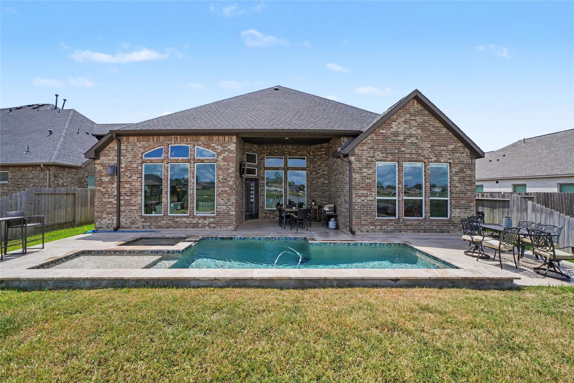 23511 Meritage Drive, Alvin, TX 77511 Dive into relaxation with your amazing pool, perfectly complementing this charming brick home, ideal for entertaining and unwinding.