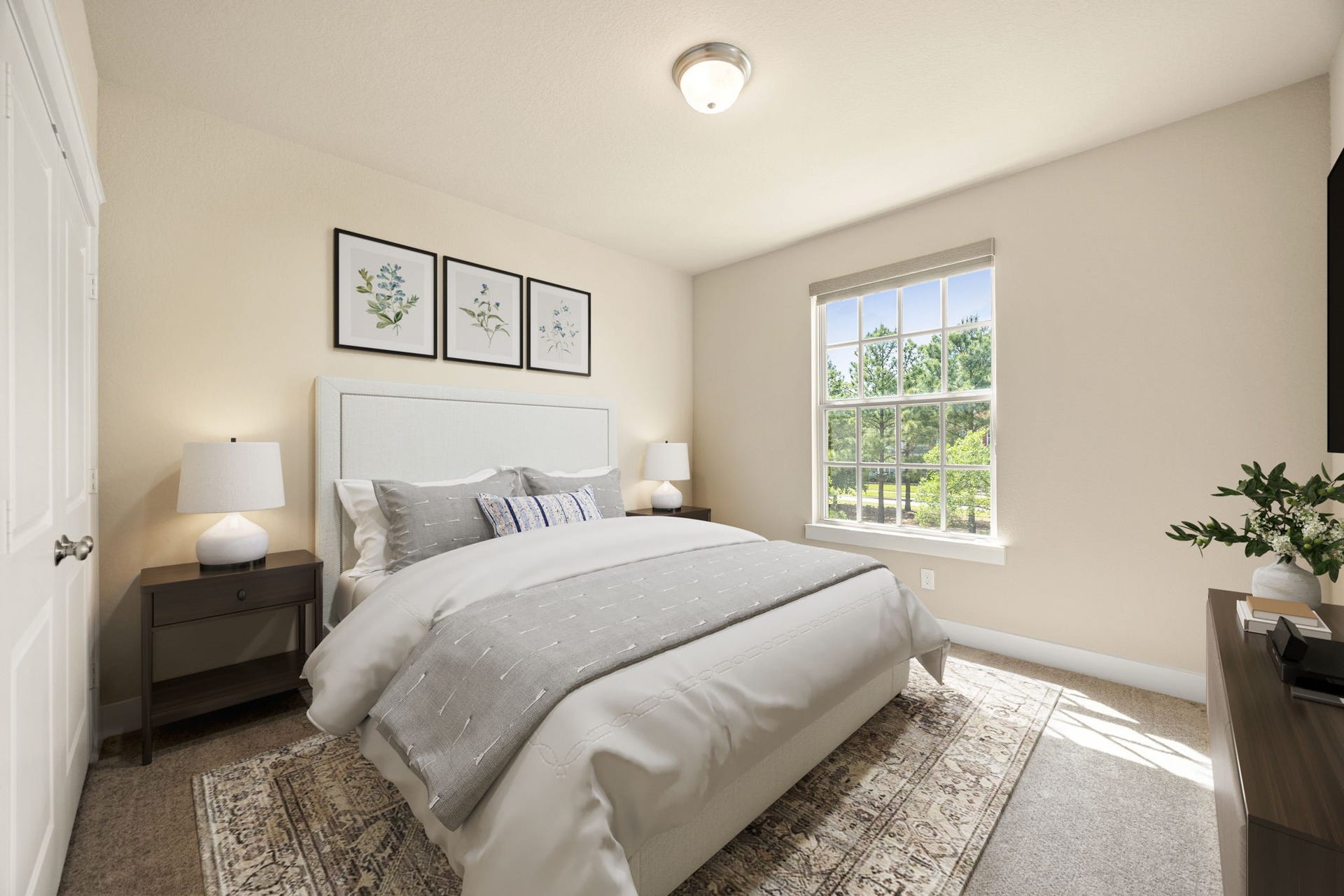 14 Kendrick Pines Boulevard, The Woodlands, TX 77389 The secondary bedrooms are designed as bright, tranquil retreats, featuring plush carpeting and a soft neutral palette that accommodates any style. Large windows invite abundant natural light and offer peaceful views of the surrounding greenery, creating a warm and inviting atmosphere. Each room provides ample space and generous closet storage, ensuring comfort and privacy for family members or guests alike.