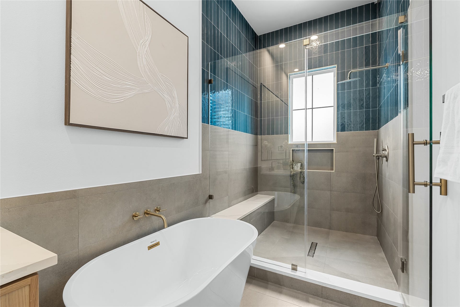 Deluxe soaking tub paired with an adjacent glass walk-in shower for a daily spa experience.