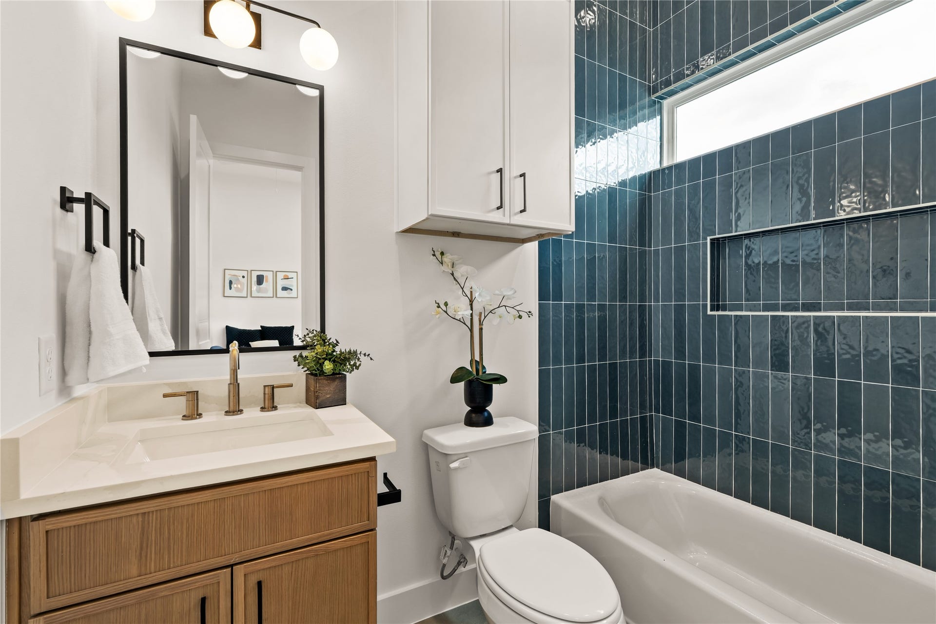 Elegant full bathroom offering convenience and privacy for guests or family.