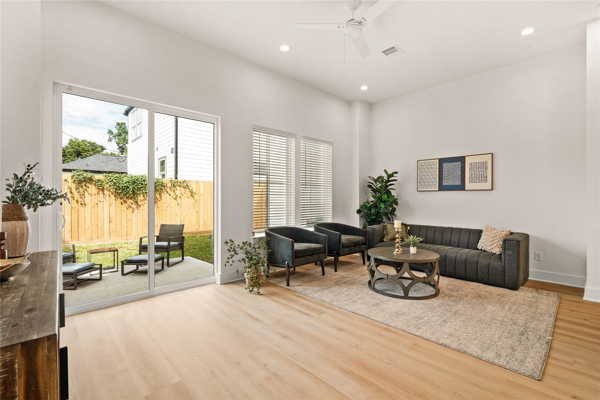 Bright living room with direct sliding door access to the private back patio.