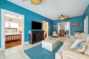 4711 Avenue S, Galveston, TX 77551 Relax and recharge in this stylish living room, where comfort meets coastal charm