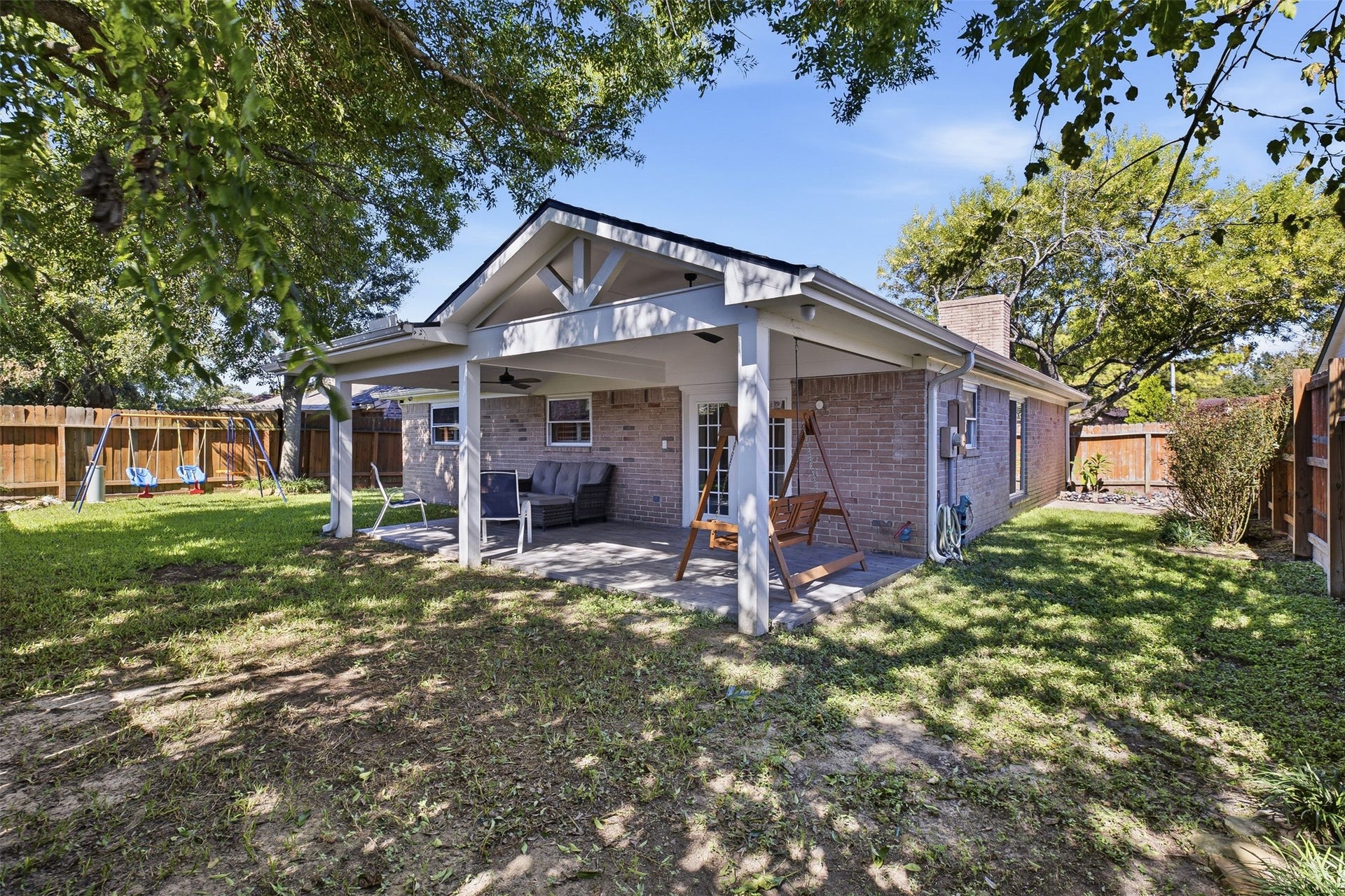 22611 Carter Moir Lane, Katy, TX 77449 Step outside to a spacious covered patio overlooking the fenced backyard and mature shade treesan inviting setting for relaxing, entertaining, or enjoying outdoor dining year-round.