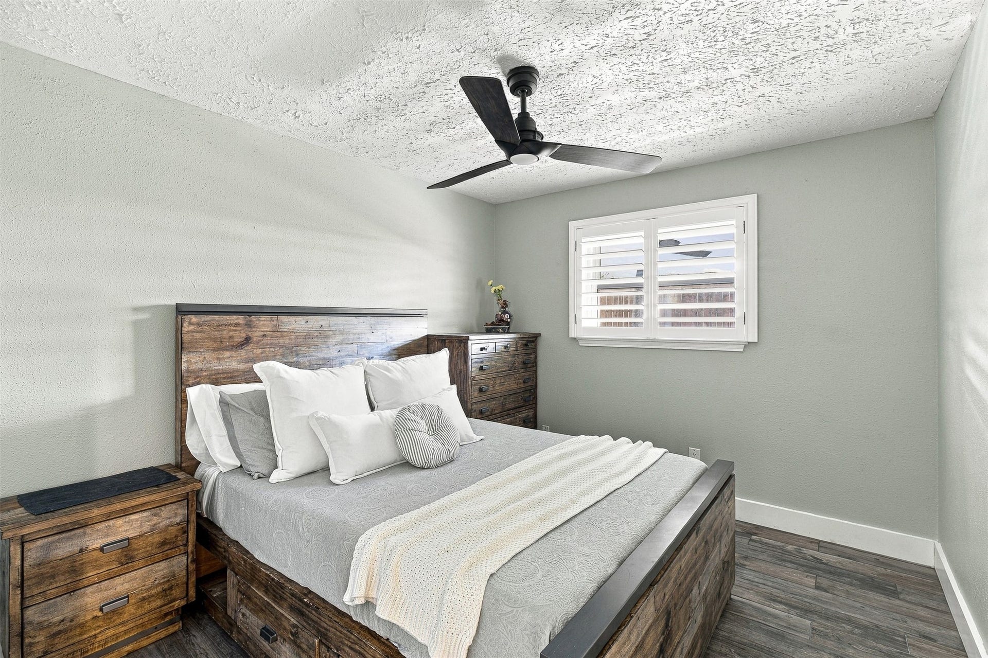 22611 Carter Moir Lane, Katy, TX 77449 Bright secondary bedroom with updated porcelain tile flooring, modern ceiling fan, plantation shutters, and plenty of natural light.