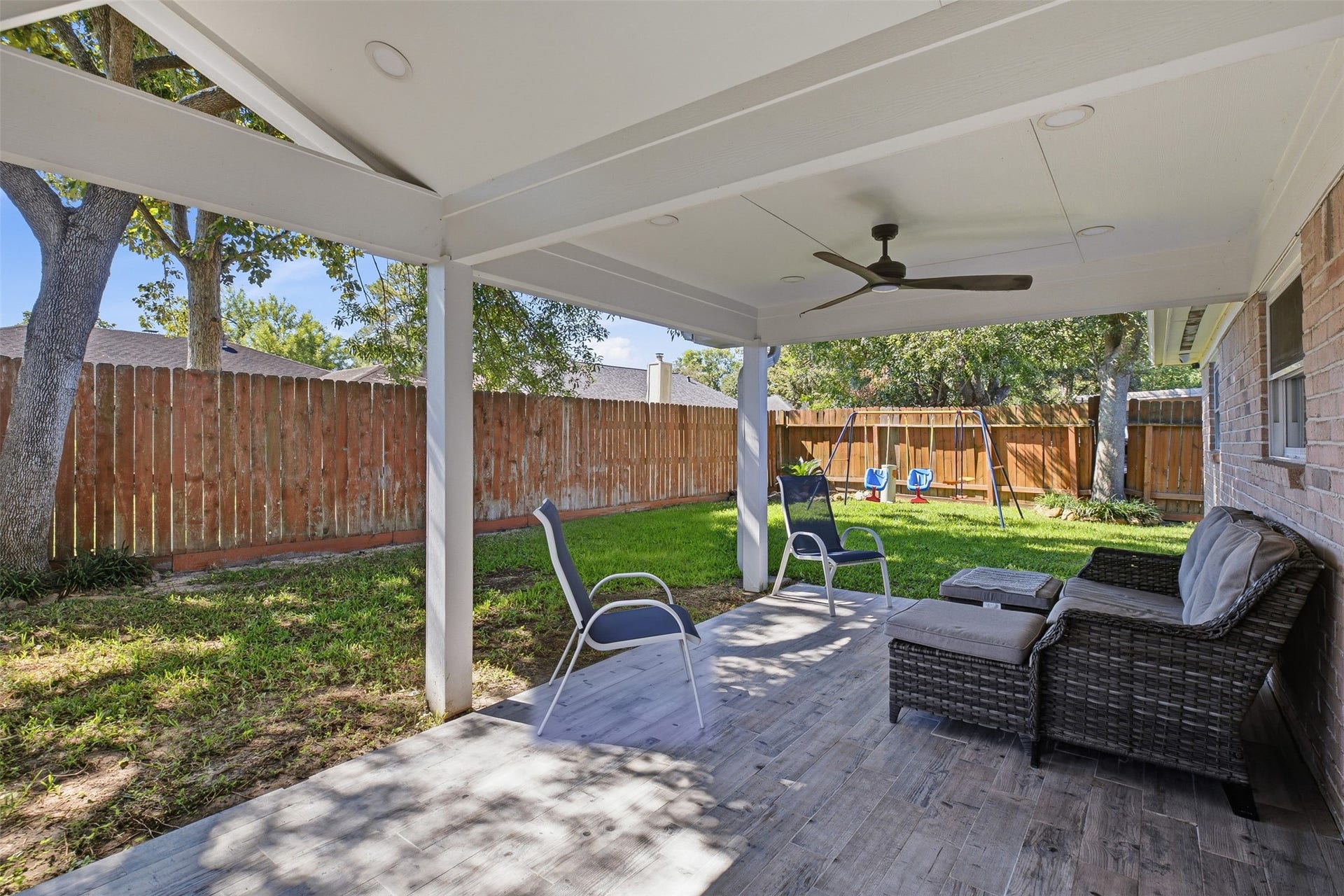 22611 Carter Moir Lane, Katy, TX 77449 Expansive covered patio extends the living space outdoors and overlooks the fenced backyard with modern fans with recessed lighted along with the beautiful mature shaded trees!
