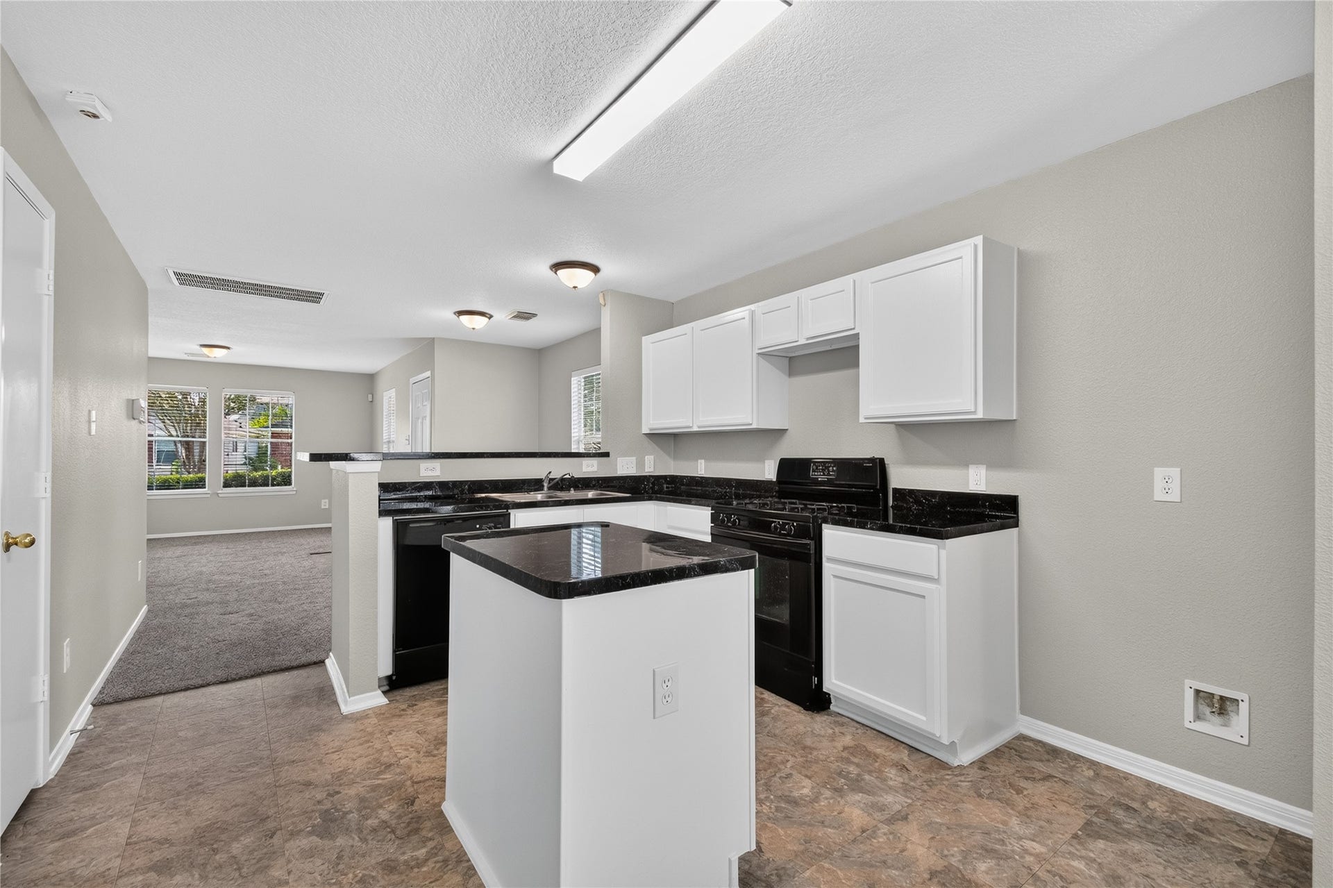 19547 Fletcher Way Drive, Houston, TX 77073 The kitchens practical layout provides plenty of prep space while remaining connected to the adjoining living areas.