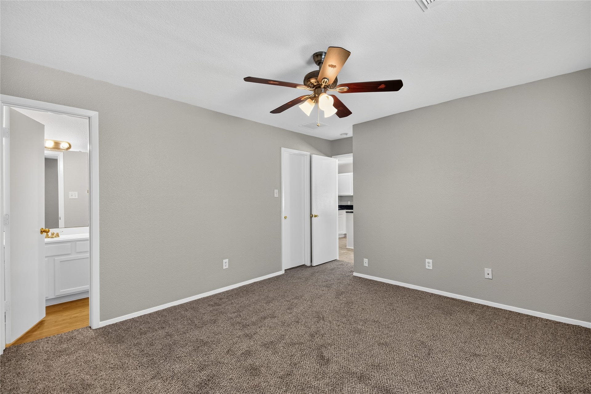 19547 Fletcher Way Drive, Houston, TX 77073 The primary bedroom shows its connection to the ensuite bath and nearby closet/storage areas.