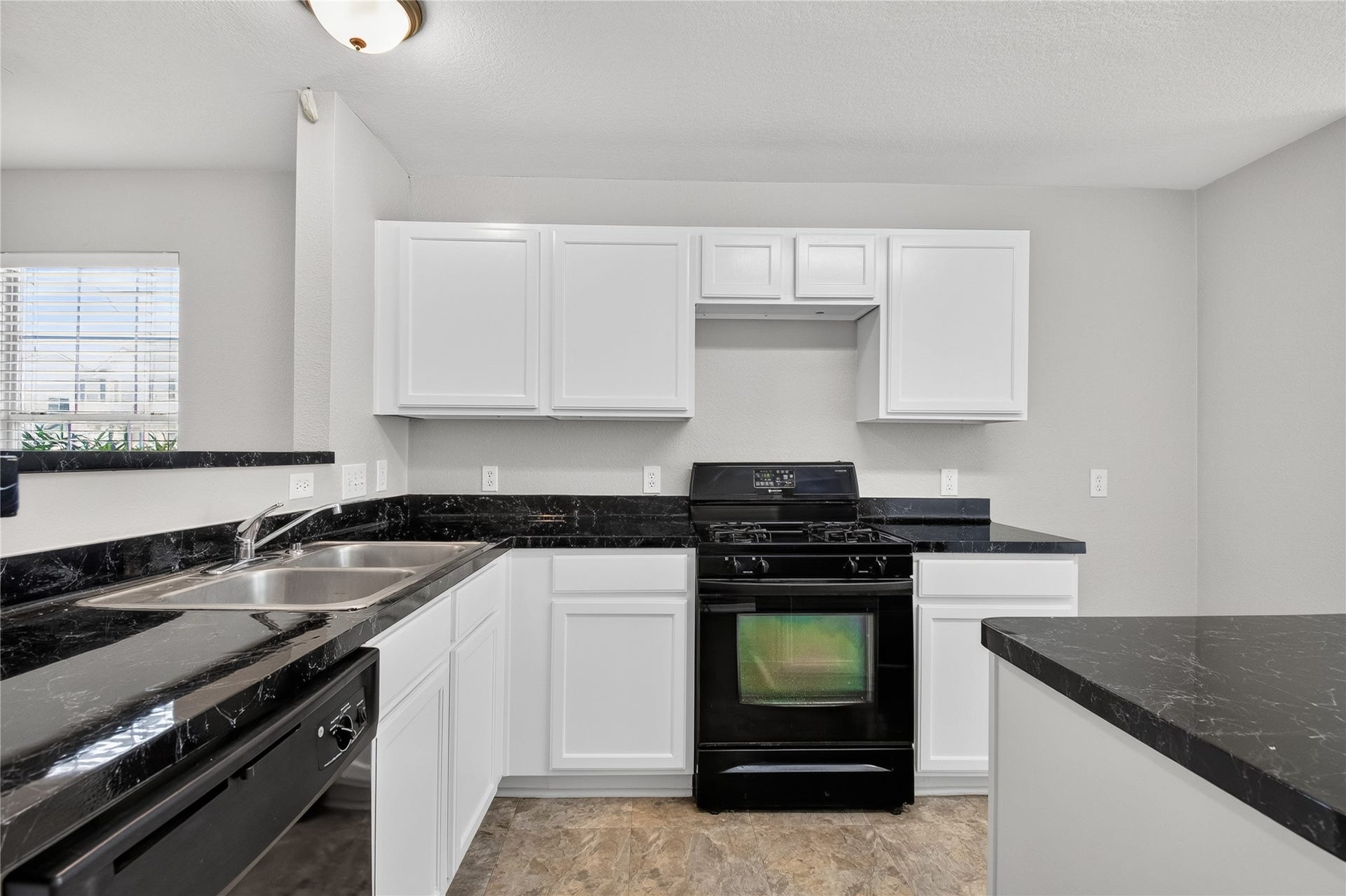 19547 Fletcher Way Drive, Houston, TX 77073 A closer kitchen view highlights the abundant cabinetry, counter workspace, and gas cooking.