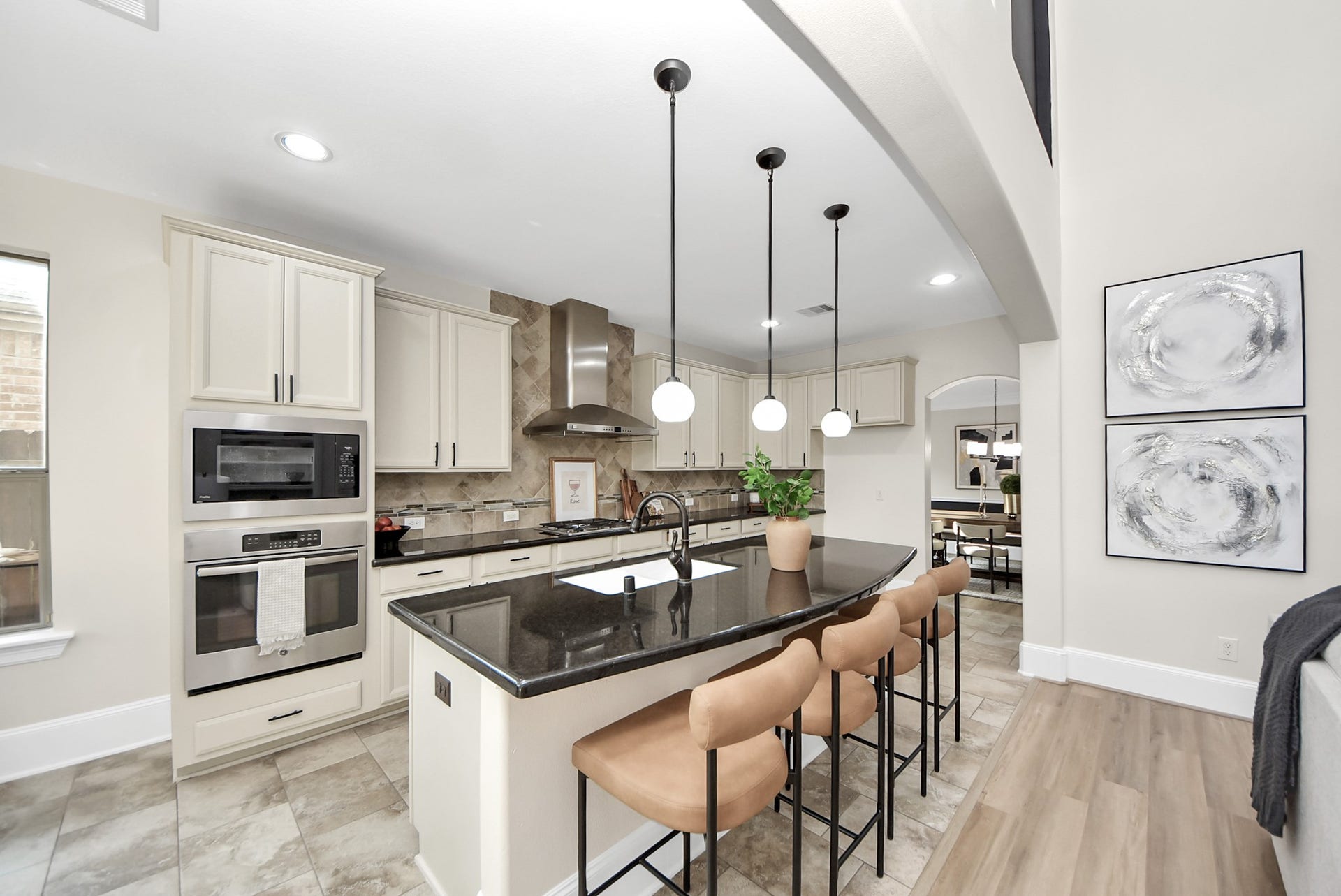 9815 Patricia Haven Lane, Humble, TX 77396 kitchen opens to the living area with stainless steel built in appliances